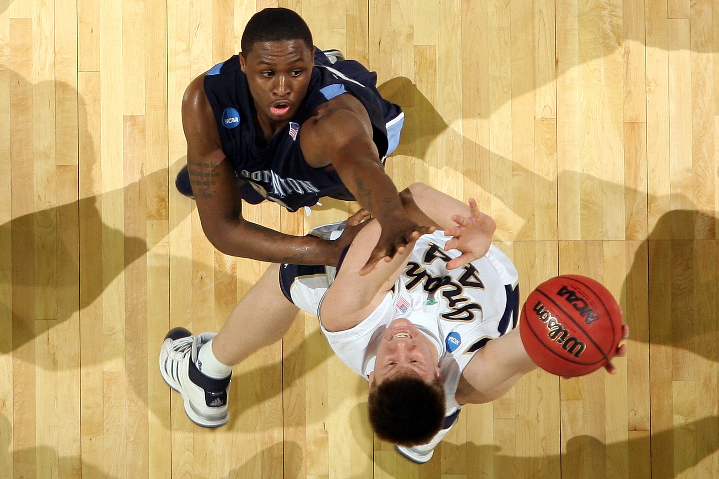 NEW ORLEANS - MARCH 18:  Luke Harangody #44 of the Notre Dame Fighting Irish fights for a rebound with Frank Hassell #21 of the Old Dominion Monarchs during the first round of the 2010 NCAA men's basketball tournament at the New Orleans Arena on March 18,