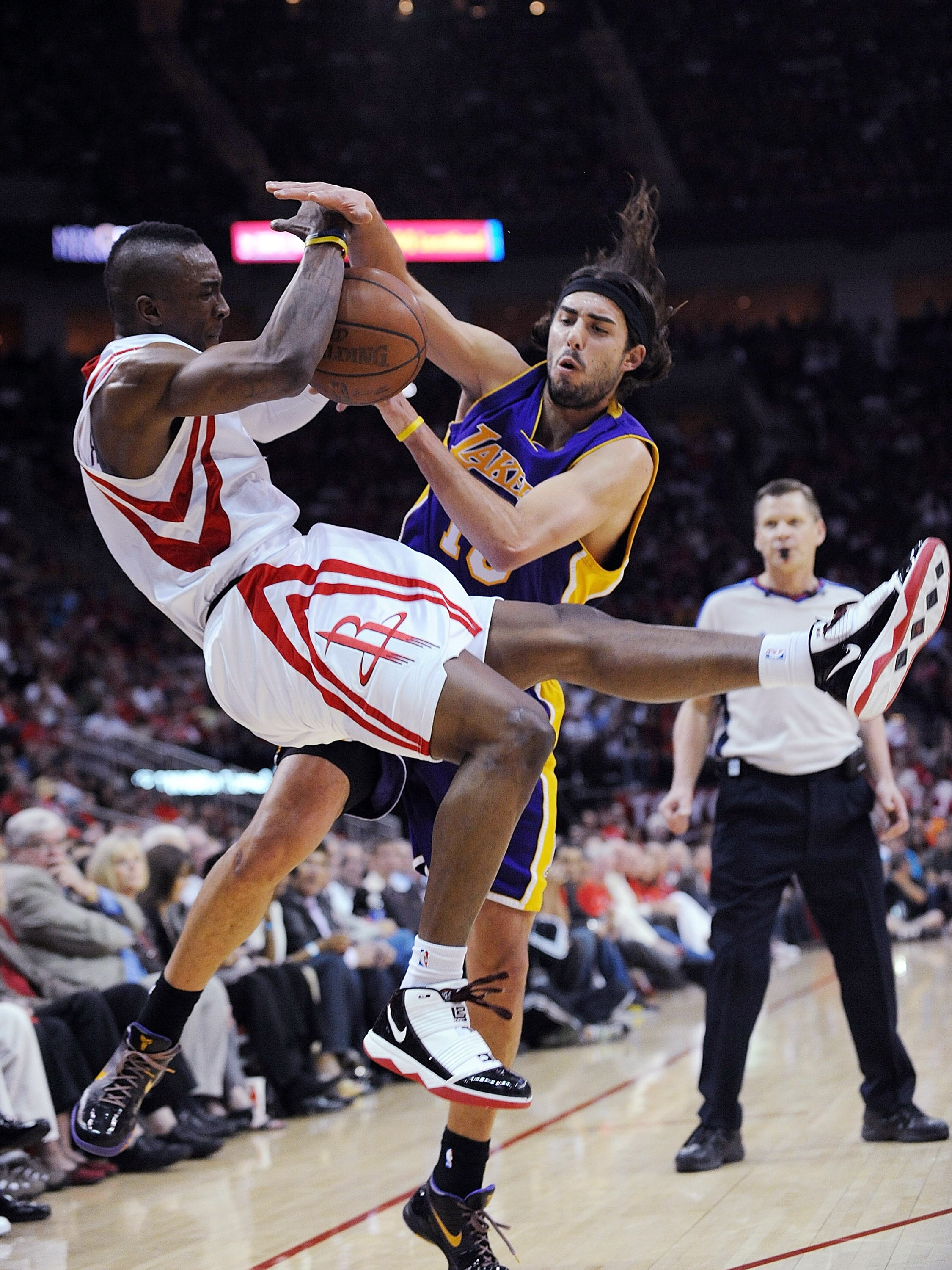 HOUSTON - MAY 08:  Guard Von Wafer #13 of the Houston Rockets is fouled by Sasha Vujacic #18 of the Los Angeles Lakers in Game Three of the Western Conference Semifinals during the 2009 NBA Playoffs at Toyota Center on May 8, 2009 in Houston, Texas. NOTE