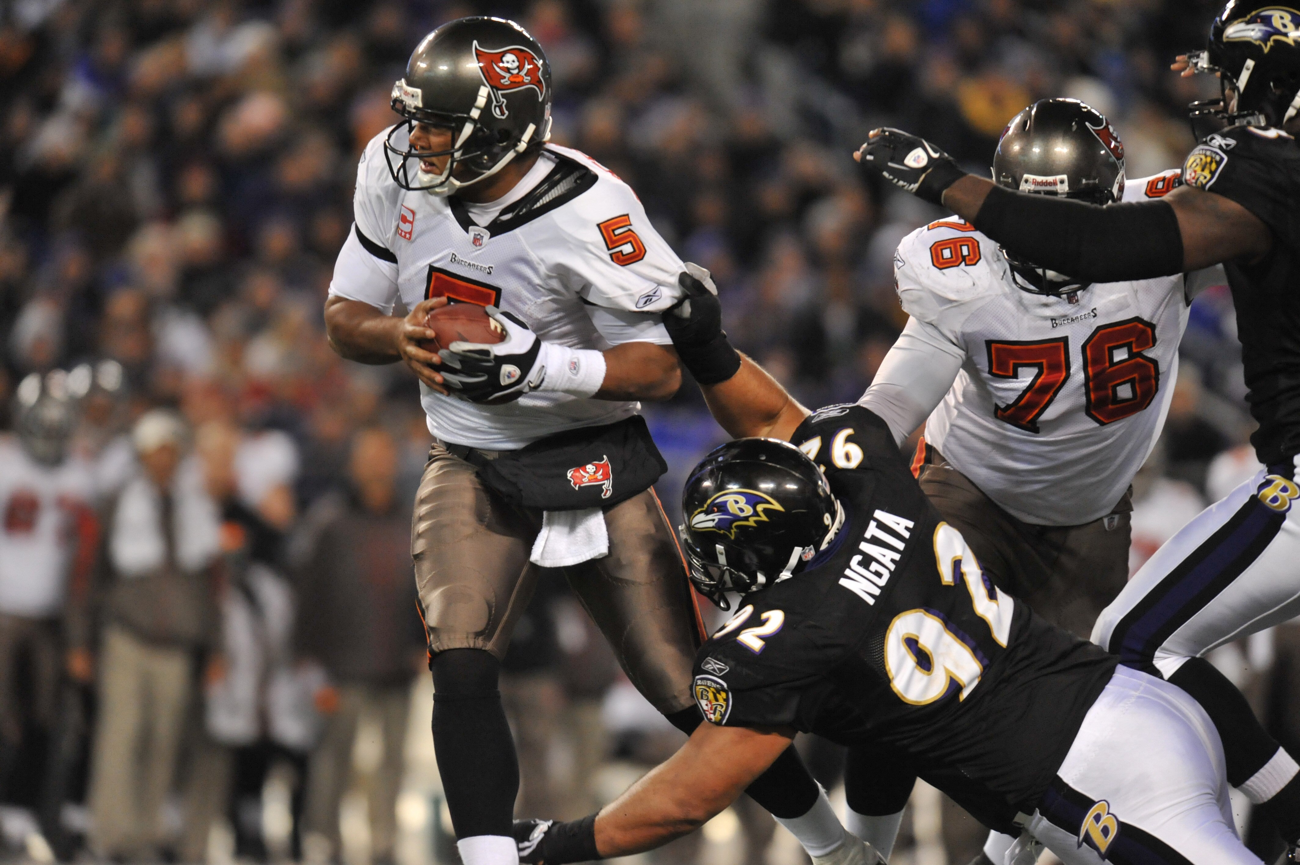 BALTIMORE, MD - NOVEMBER 28:  Josh Freeman #5 of the Tampa Bay Buccaneers is almost sacked by Haloti Ngata #92 of the Baltimore Ravens at M&T Bank Stadium on November 28, 2010 in Baltimore, Maryland. The Ravens defeated the Buccaneers 17-10. (Photo by Lar