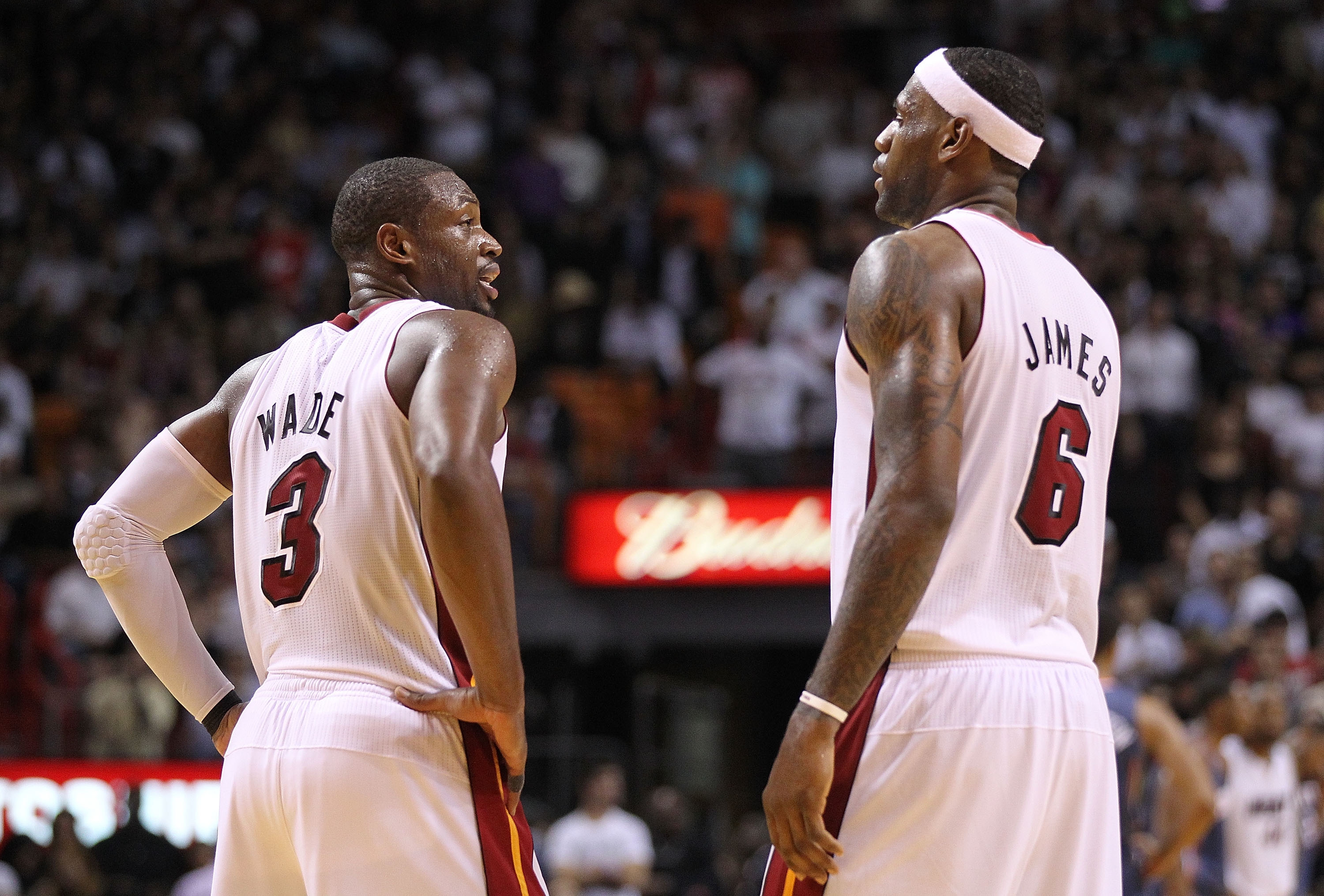 MIAMI - NOVEMBER 19:  Dwyane Wade #3 and LeBron James #6 of the Miami Heat look on during a game against the Charlotte Bobcats at American Airlines Arena on November 19, 2010 in Miami, Florida. NOTE TO USER: User expressly acknowledges and agrees that, by