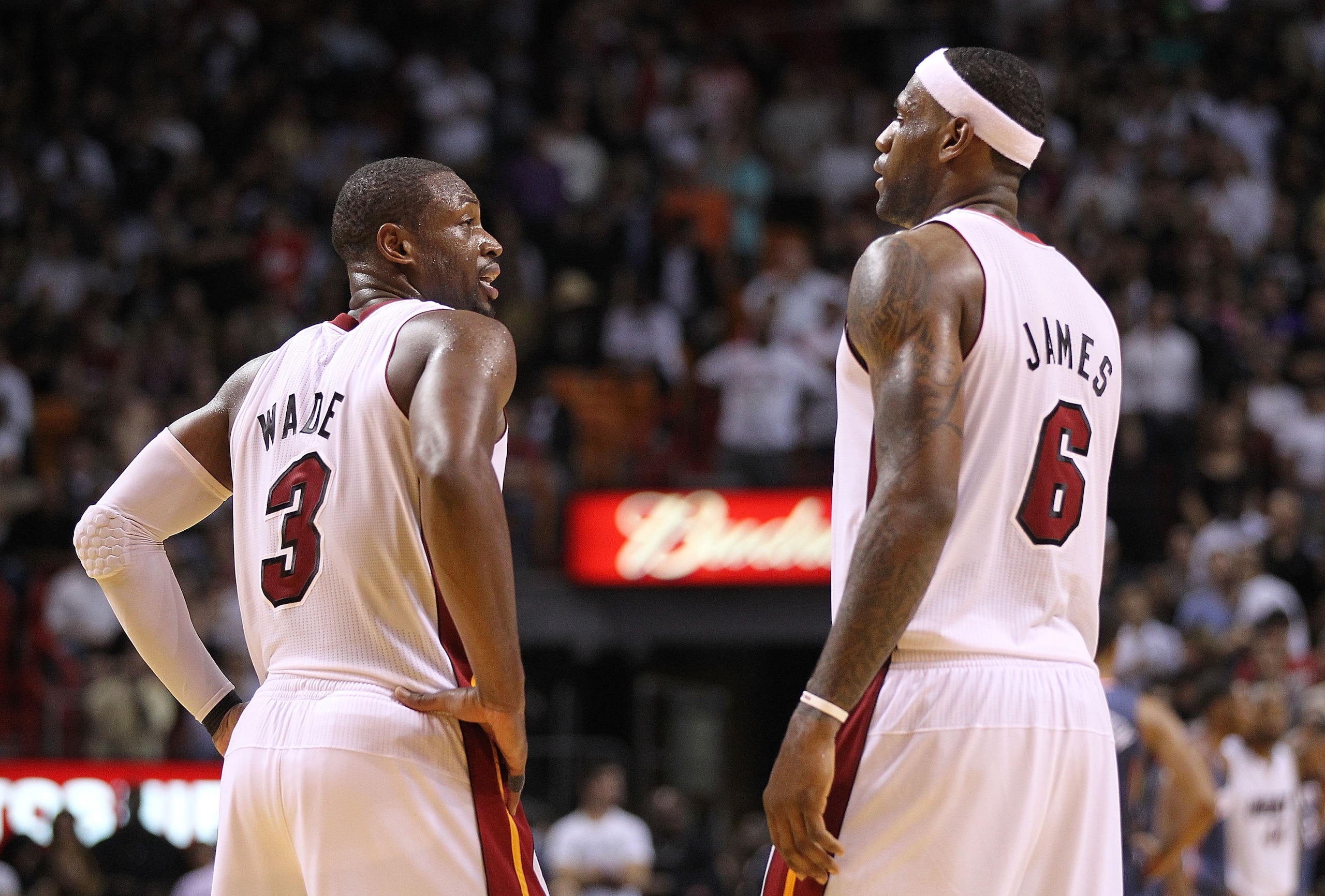 MIAMI - NOVEMBER 19:  Dwyane Wade #3 and LeBron James #6 of the Miami Heat look on during a game against the Charlotte Bobcats at American Airlines Arena on November 19, 2010 in Miami, Florida. NOTE TO USER: User expressly acknowledges and agrees that, by
