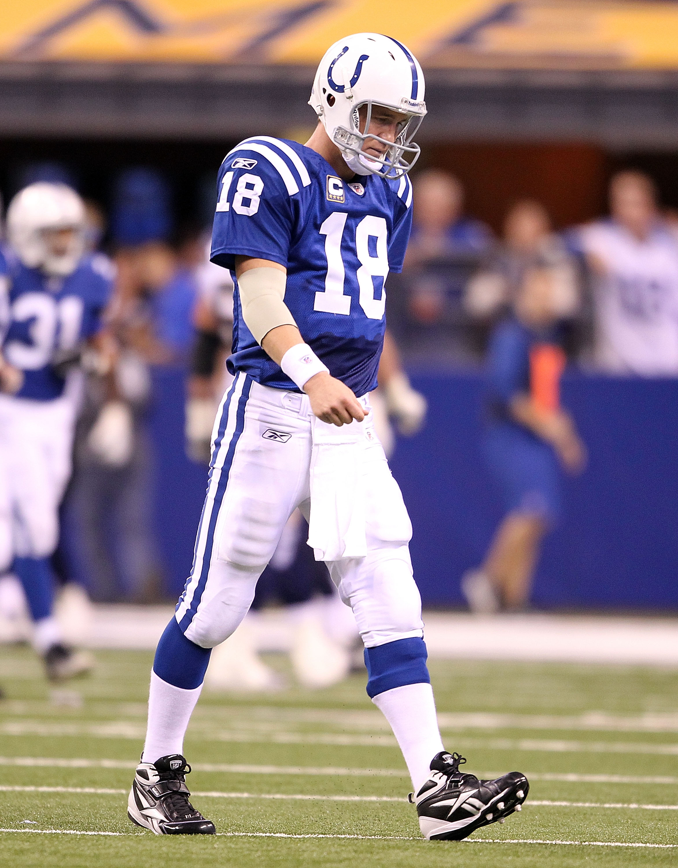 INDIANAPOLIS - NOVEMBER 28:  Peyton Manning #18 of the Indianapolis Colts walks off of the field after throwing an interception that was returned for a touchdown during the NFL game against the San Diego Chargers at Lucas Oil Stadium on November 28, 2010 