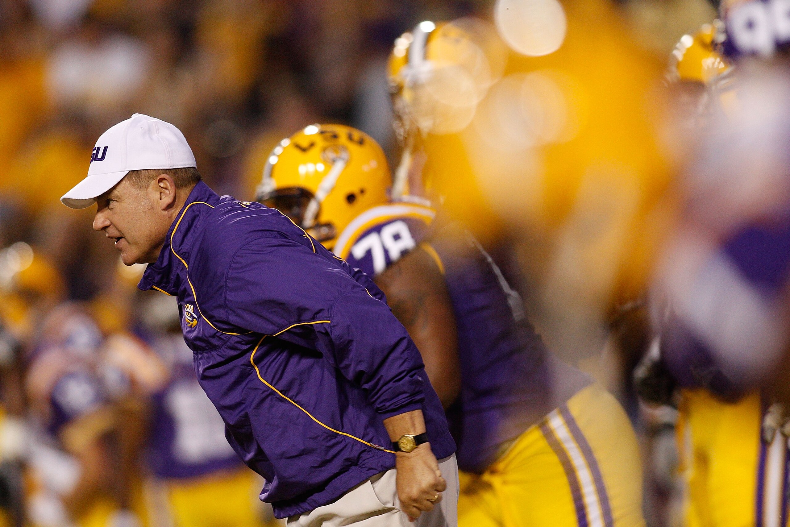 BATON ROUGE, LA - NOVEMBER 13:  Head coach Les Miles of the Louisiana State University Tigers runs on to the field during pregame before playing the  Louisiana Monroe Warhawks at Tiger Stadium on November 13, 2010 in Baton Rouge, Louisiana.  (Photo by Chr
