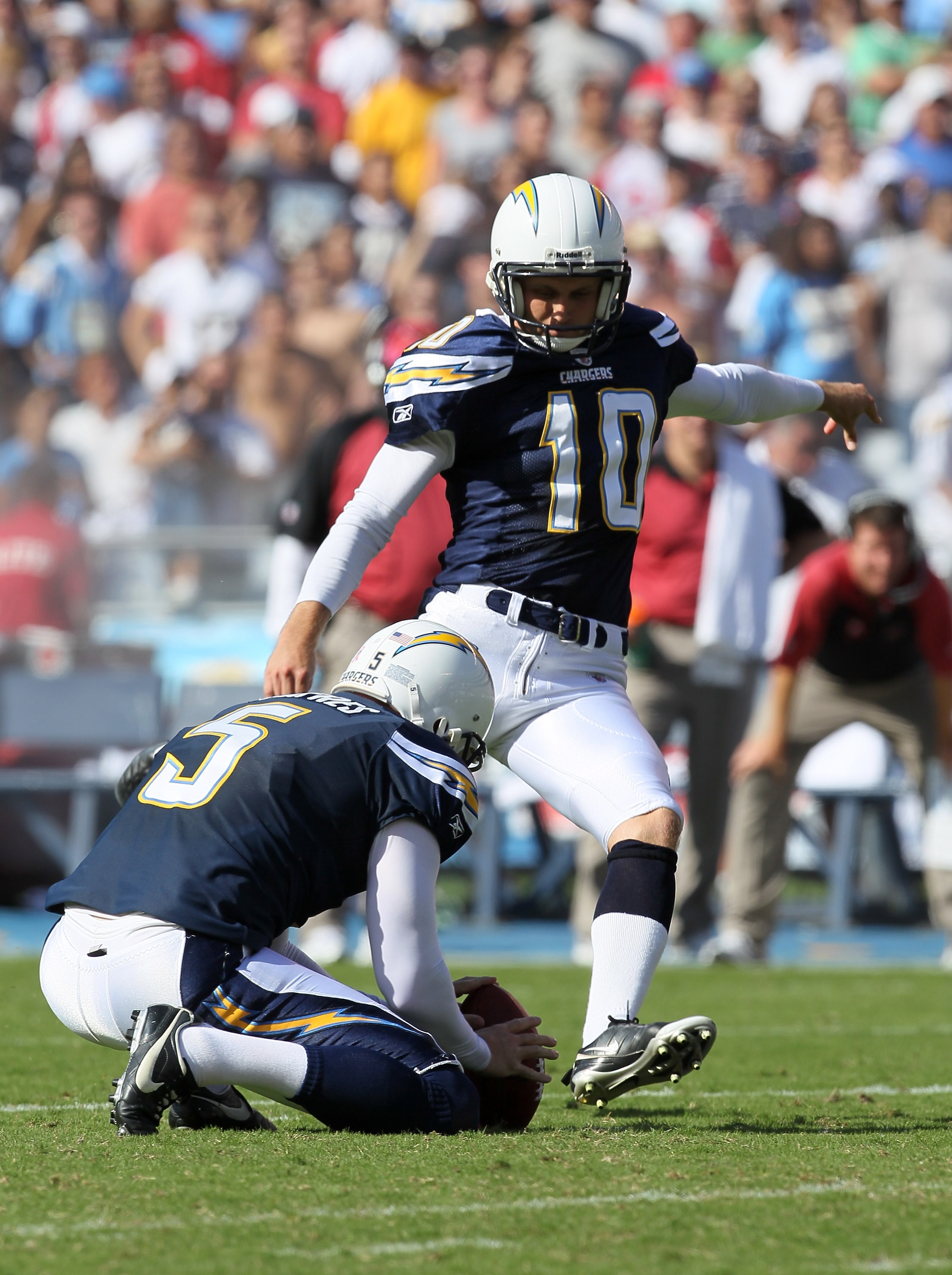 SAN DIEGO - OCTOBER 3:  Nate Kaeding #10 of the San Diego Chargers kicks a field goal out of the hold  of Mike Scifres #5 against the Arizona Cardinals at Qualcomm Stadium on October 3, 2010 in San Diego, California.  The Chargers won 41-10.  (Photo by St