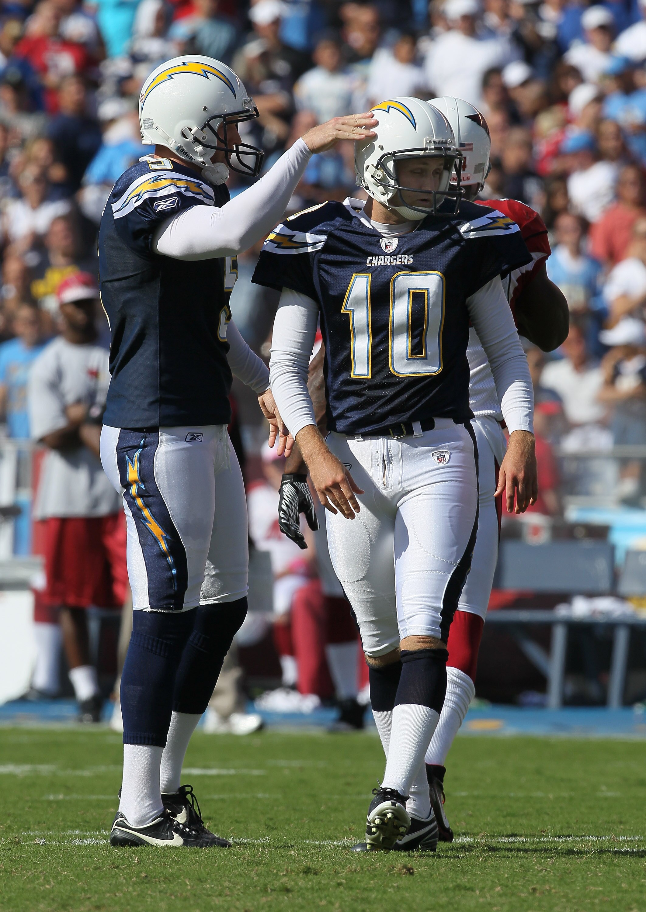 SAN DIEGO - OCTOBER 03:  Kicker Nate Kaeding #10 of the San Diego Chargers is congratulated by holder Mike Scifres #5 after making a field goal against the Arizona Cardinals at Qualcomm Stadium on October 3, 2010 in San Diego, California.  The Chargers wo