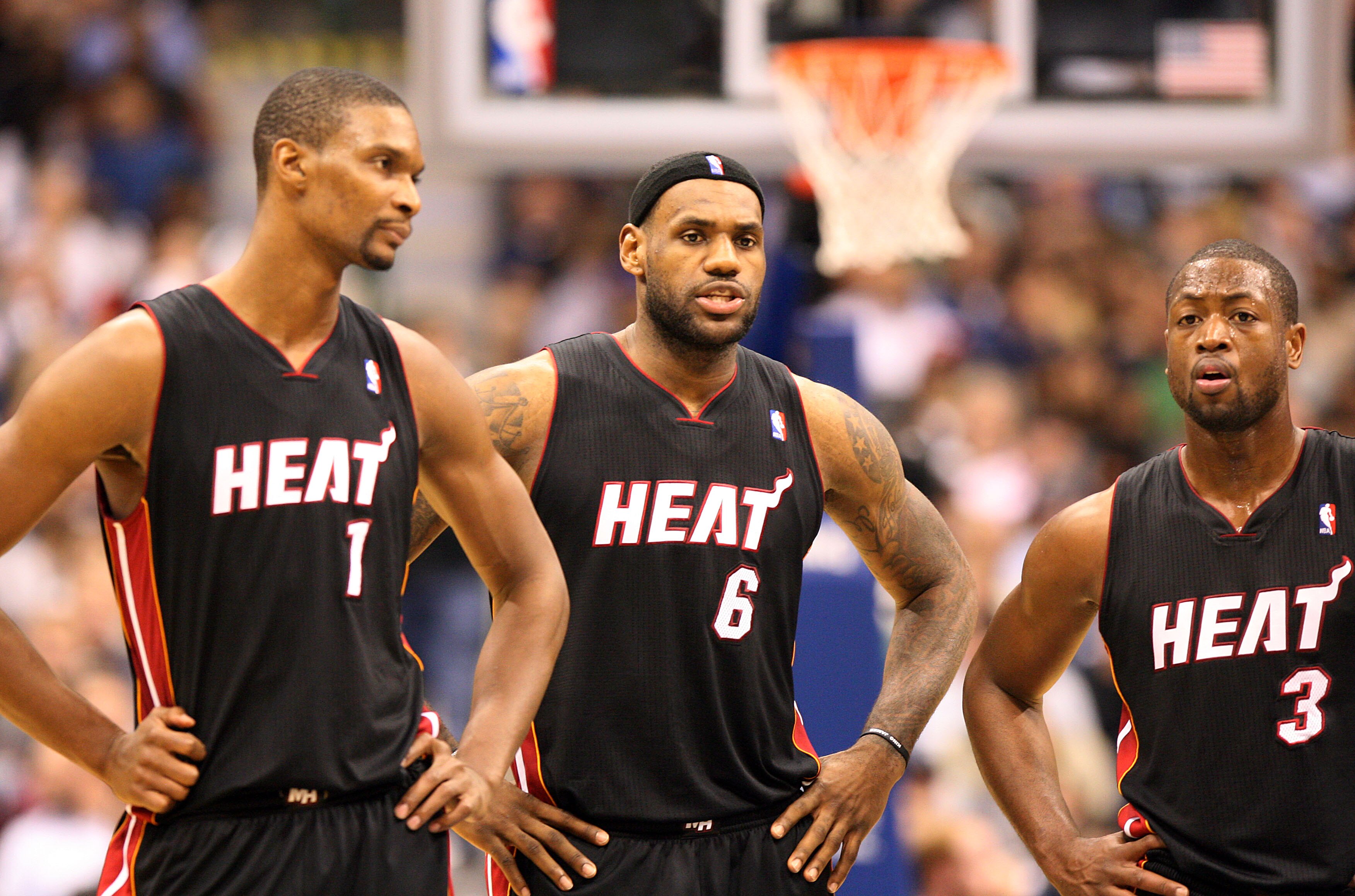 DALLAS - NOVEMBER 27: Chris Bosh #1, LeBron James #6 and Dwyane Wade #3 of the Miami Heat talk strategy during their game against the Dallas Mavericks  on November 27, 2010 at the American Airlines Center in Dallas, Texas. NOTE TO USER: User expressly ack