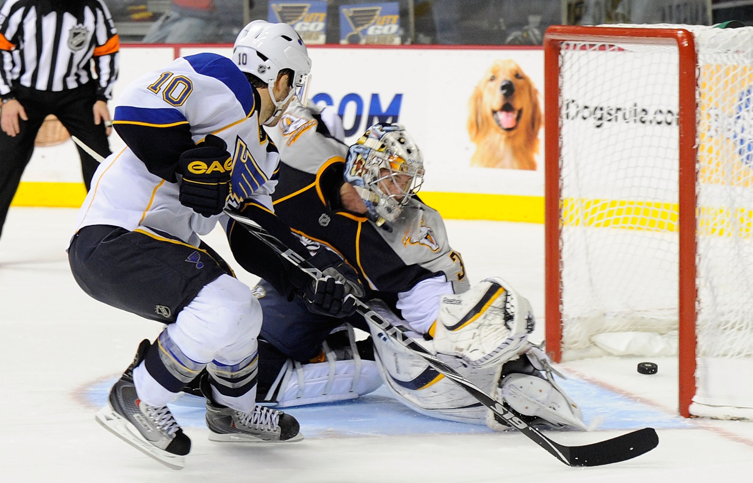 NASHVILLE, TN - NOVEMBER 24: Center Andy McDonald #10 of the St. Louis Blues scores the game winning shootout goal against goalie Pekka Rinne #35 of the Nashville Predators on November 24, 2010 at the Bridgestone Arena in Nashville, Tennessee.  (Photo by