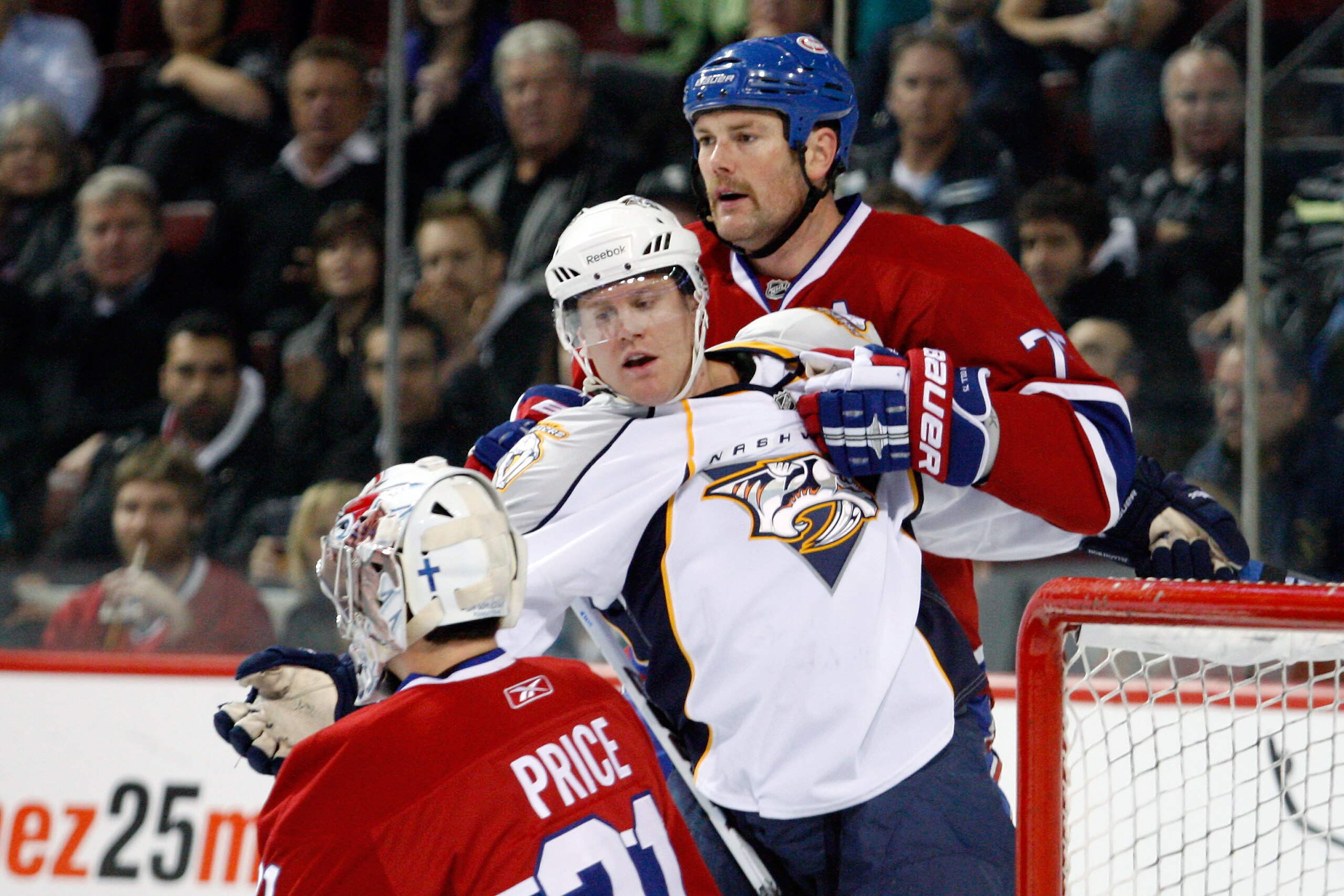 MONTREAL- NOVEMBER 18:  Hal Gill #75 of the Montreal Canadiens grabs onto Patric Hornqvist #27 of the Nashville Predators during the NHL game at the Bell Centre on November 18, 2010 in Montreal, Quebec, Canada.  The Predators defeated the Canadiens 3-0.