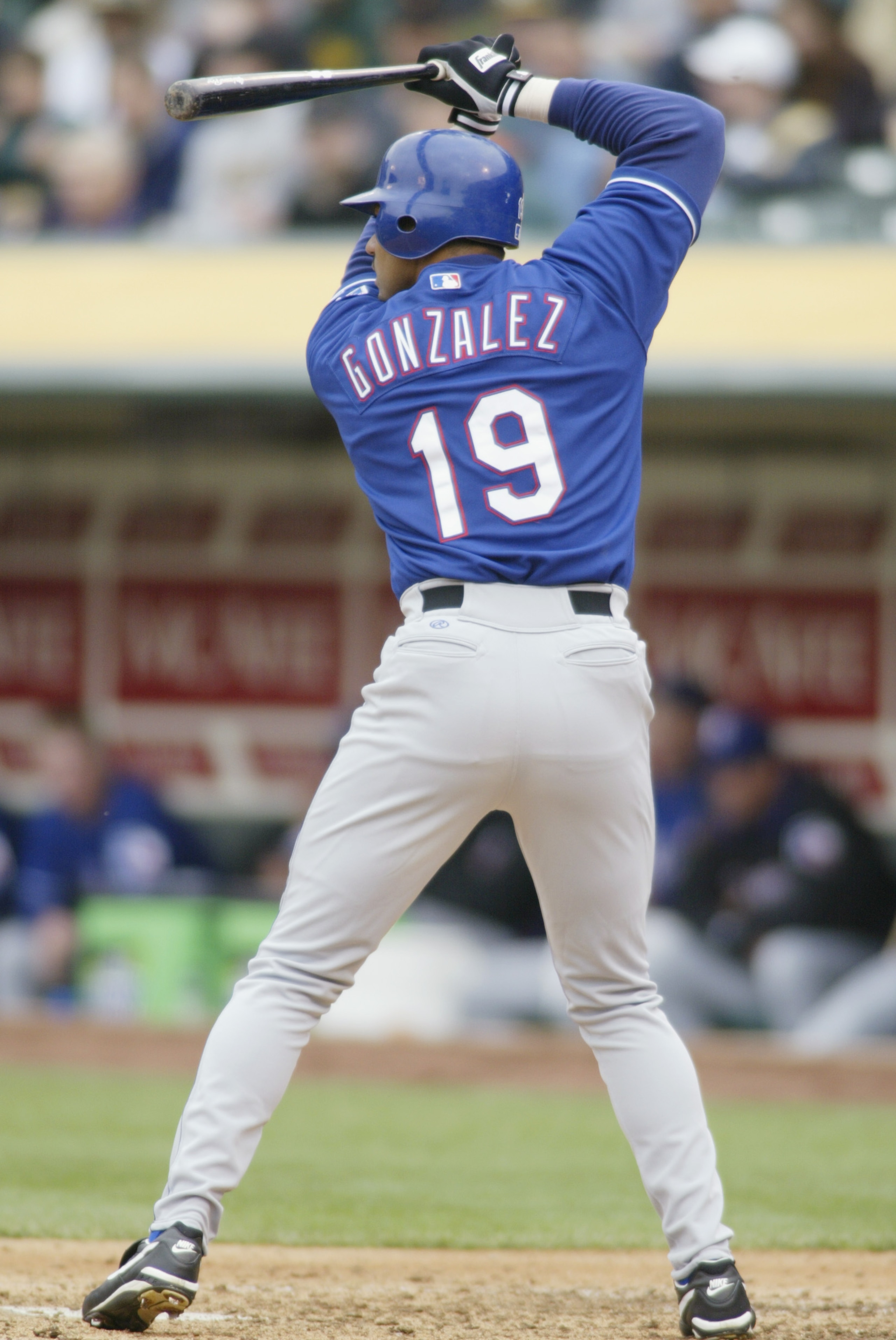 OAKLAND, CA - APRIL 4:  Right fielder Juan Gonzalez #19 of the Texas Rangers waits for the pitch during the MLB game against the Oakland Athletics at Network Associates Coliseum in Oakland, California on April 4, 2002. The Rangers won 7-5. (Photo by Jed J