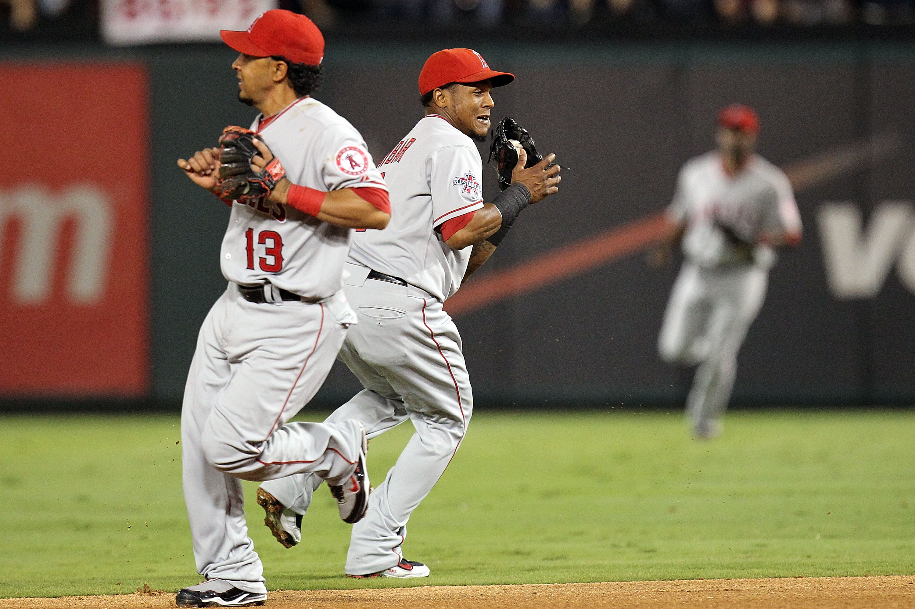 ARLINGTON, TX - OCTOBER 01:  Shortstop Erick Aybar #2 of the Los Angeles Angels of Anaheim makes the fly out against Julio Borbon of the Texas Rangers at Rangers Ballpark in Arlington on October 1, 2010 in Arlington, Texas.  (Photo by Ronald Martinez/Gett