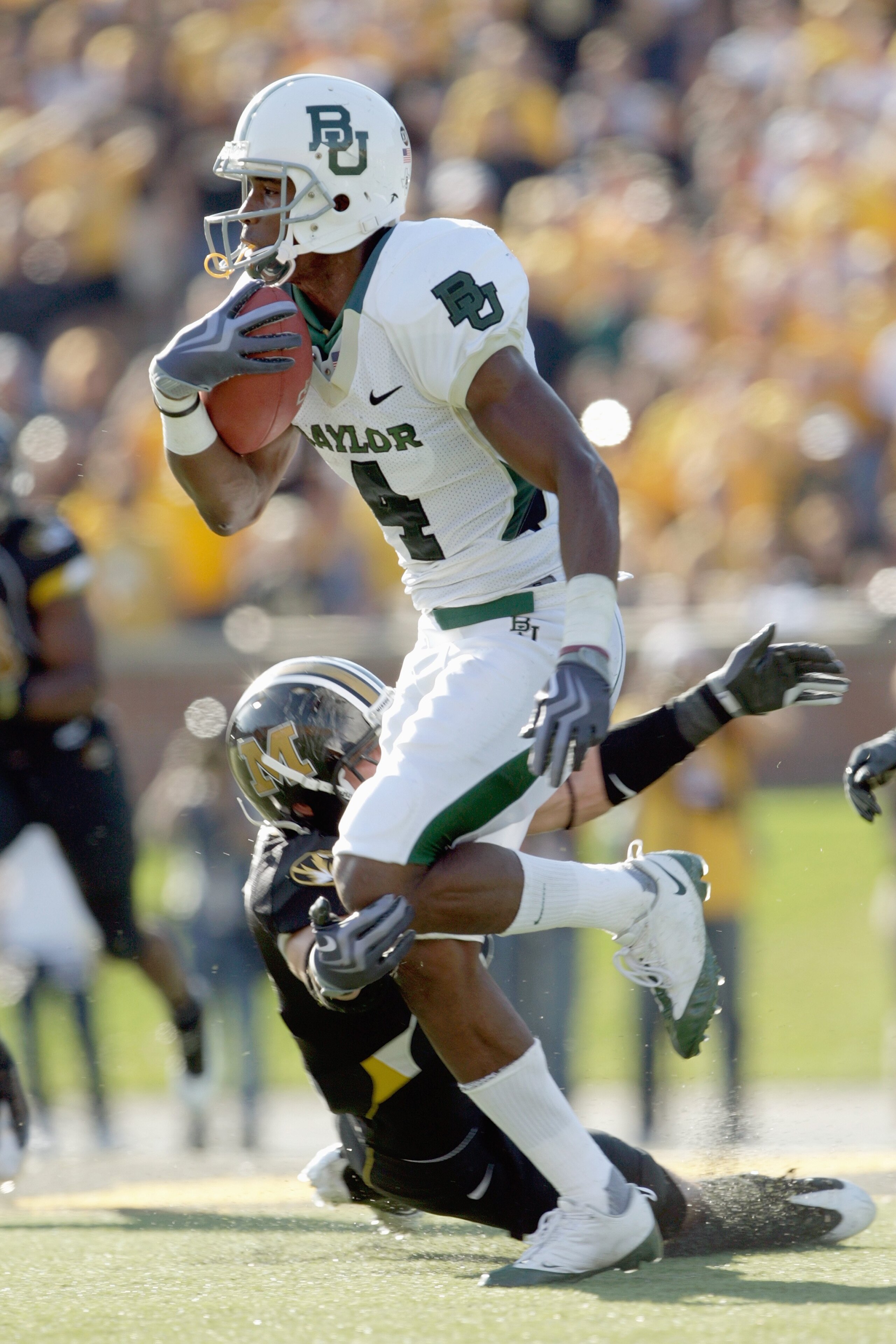 COLUMBIA, MO - NOVEMBER 7: David Gettis #4 of the Baylor Bears carries the ball during the game against the Missouri Tigers at Faurot Field at Memorial Stadium on November 7, 2009 in Columbia, Missouri. (Photo by Jamie Squire/Getty Images)