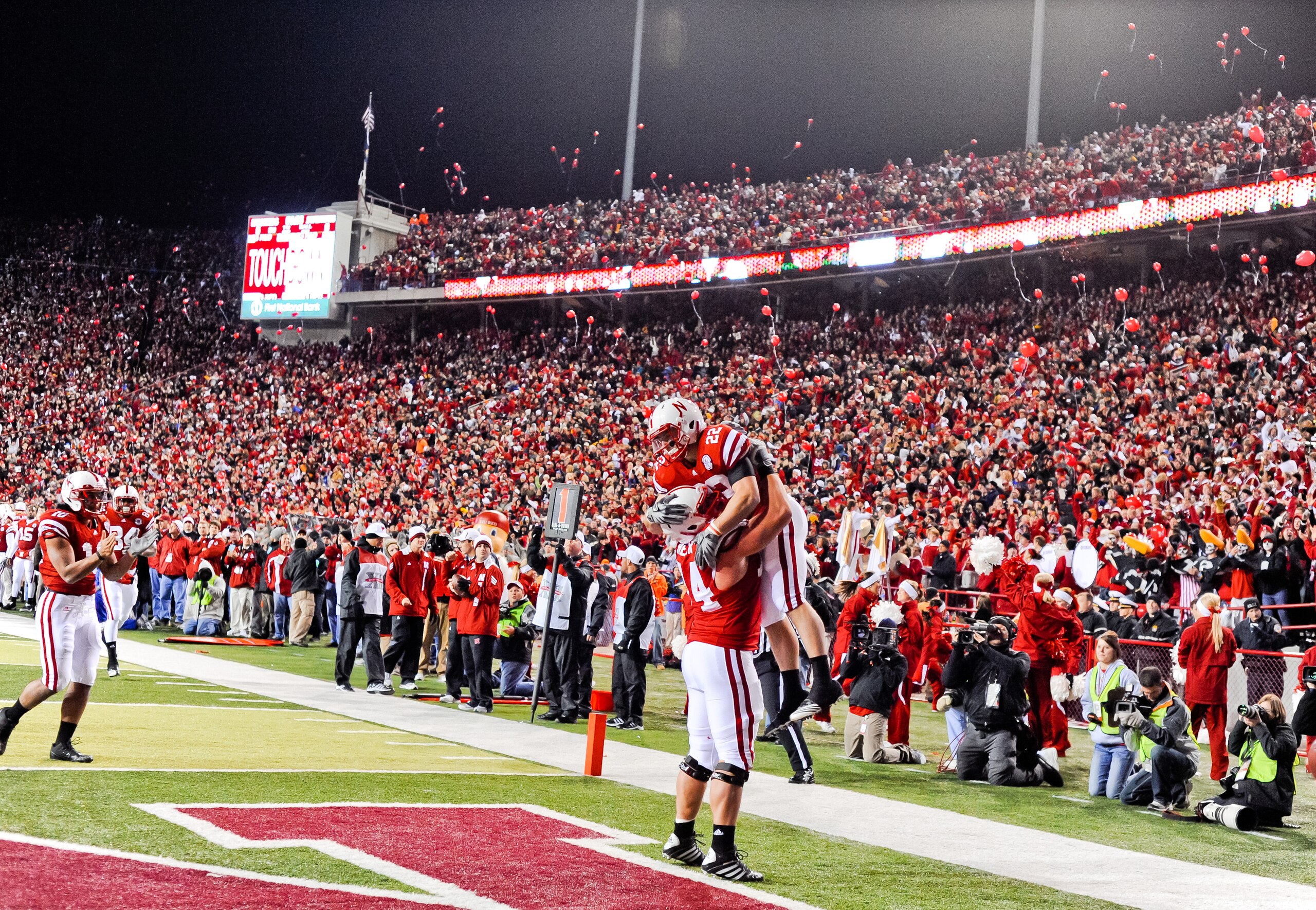 LINCOLN, NE - NOVEMBER 13: Rex Burkhead #22 and Ricky Henry #74 of the Nebraska Cornhuskers celebrate after a touchdown during their game against the Kansas Jayhawks at Memorial Stadium on November 13, 2010 in Lincoln, Nebraska. Nebraska Defeated Kansas 2