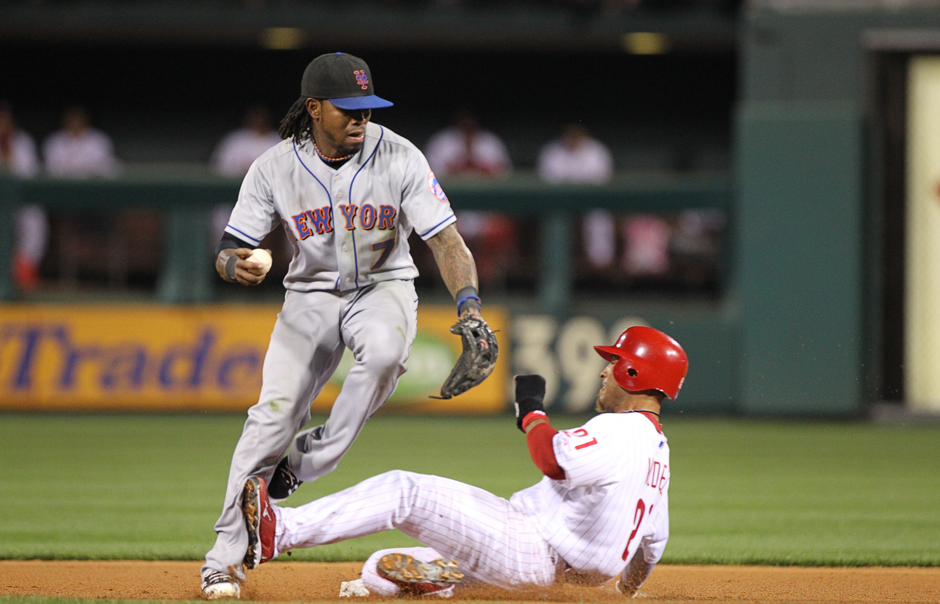 PHILADELPHIA - SEPTEMBER 25: Shortstop Jose Reyes #7 of the New York Mets attempts to avoid the slide of shortstop Wilson Valdez #21 of the Philadelphia Phillies during a game at Citizens Bank Park on September 25, 2010 in Philadelphia, Pennsylvania. The
