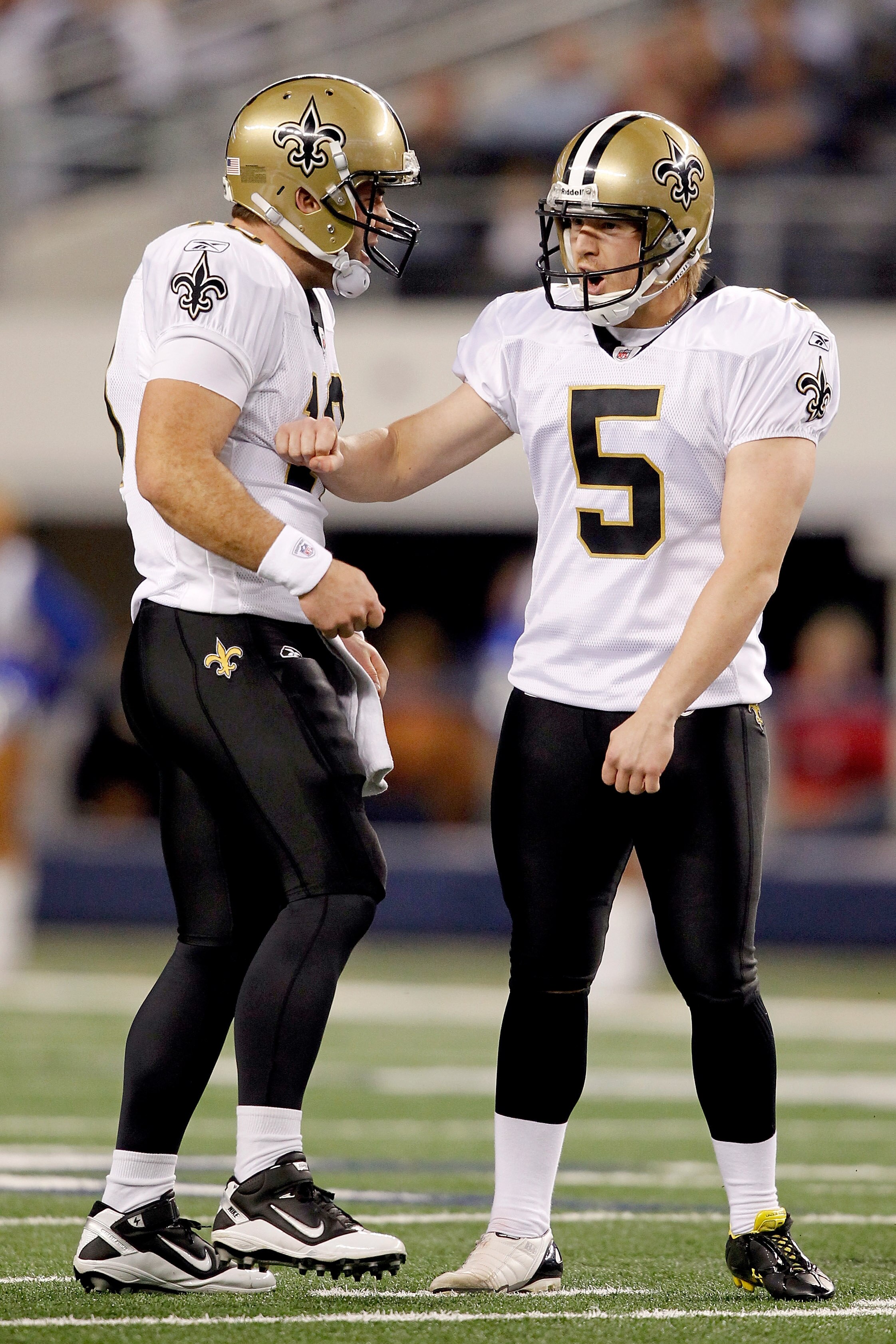 ARLINGTON, TX - NOVEMBER 25: Garrett Hartley #5 of the New Orleans Saints celebrates with Chase Daniel #10 after kicking a field goal against the Dallas Cowboys at Cowboys Stadium on November 25, 2010 in Arlington, Texas.  (Photo by Matthew Stockman/Getty