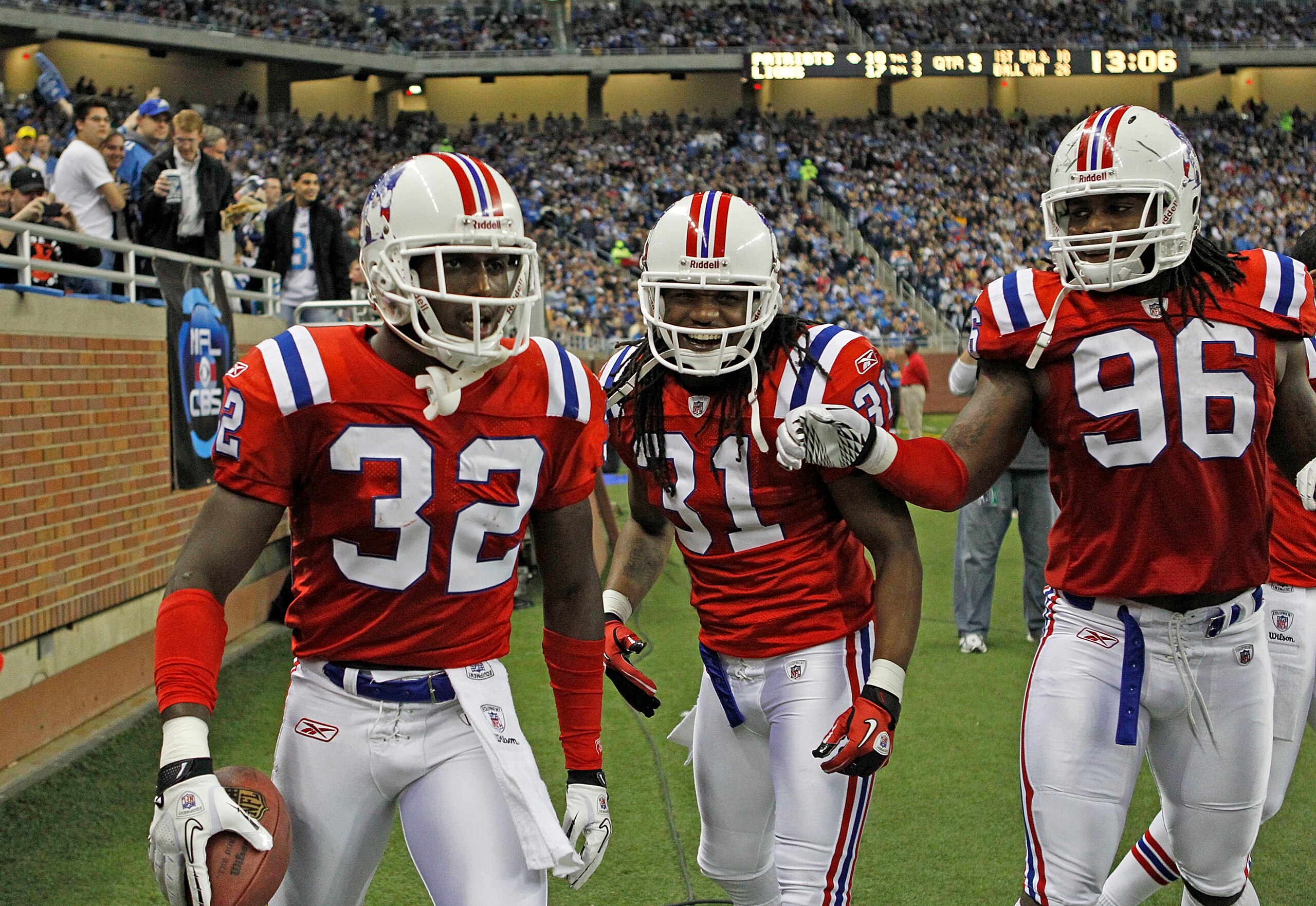 DETROIT - NOVEMBER 25:  Devin McCourty #32 of the New England Patriots celebrates his interception with teammates Brandon Meriweather #31 and Jermaine Cunningham #96 during the fourth quarter of the game against the Detroit Lions at Ford Field on November