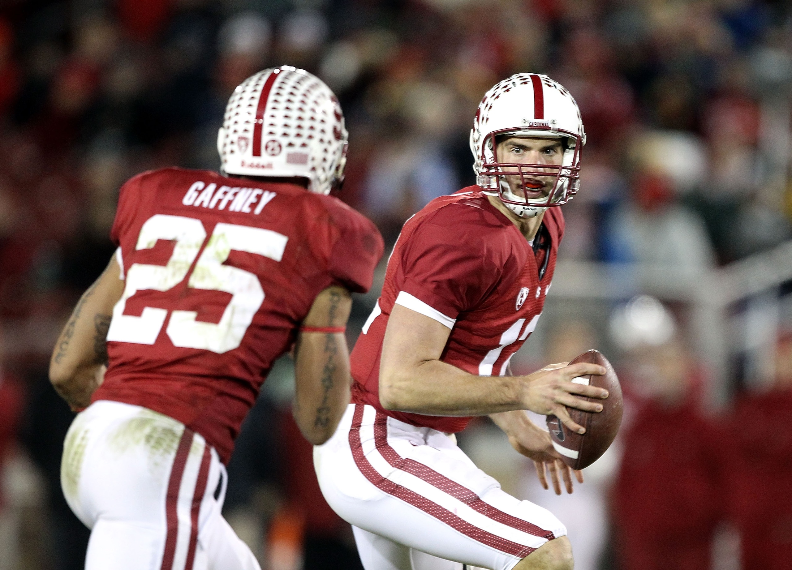 PALO ALTO, CA - NOVEMBER 27:  Andrew Luck #12 of the Stanford Cardinal pitches the ball to Tyler Gaffney #25 during their game against the Oregon State Beavers at Stanford Stadium on November 27, 2010 in Palo Alto, California.  (Photo by Ezra Shaw/Getty I