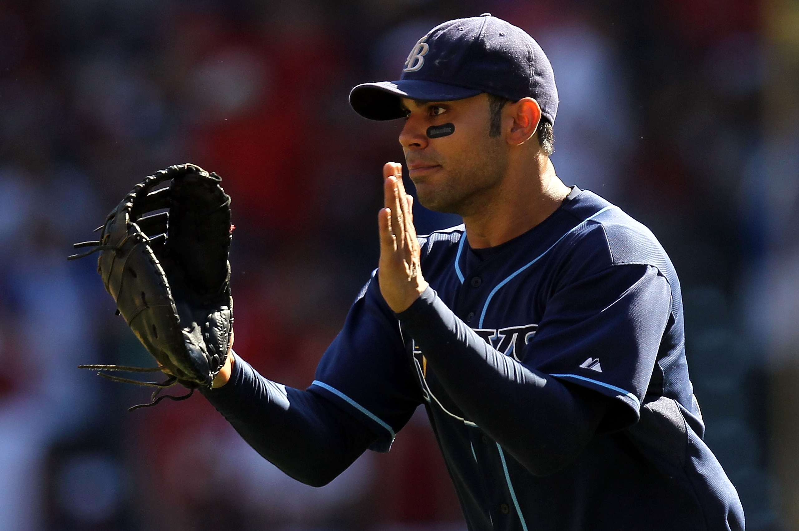 ARLINGTON, TX - OCTOBER 10: Carlos Pena #23 of the Tampa Bay Rays celebrates after a 5-2 win against the Texas Rangers during game 4 of the ALDS at Rangers Ballpark in Arlington on October 10, 2010 in Arlington, Texas. (Photo by Ronald Martinez/Getty Im ARLINGTON, TX - OCTOBER 10: Carlos Pena #23 of the Tampa Bay Rays celebrates after a 5-2 win against the Texas Rangers during game 4 of the ALDS at Rangers Ballpark in Arlington on October 10, 2010 in Arlington, Texas. (Photo by Ronald Martinez/Getty Im