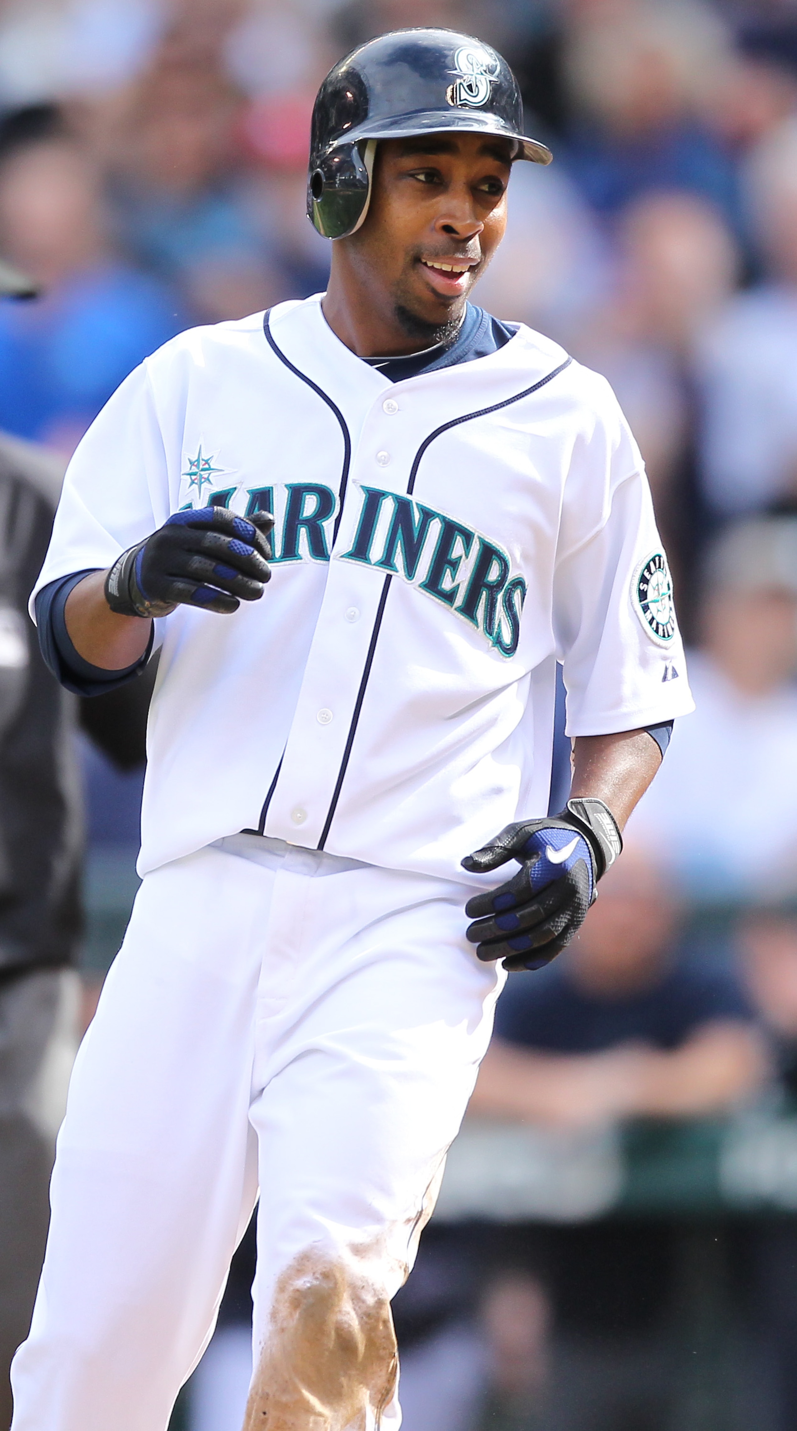 SEATTLE - SEPTEMBER 19: Chone Figgins #9 of the Seattle Mariners smiles after scoring against catcher Matt Treanor #20 of the Texas Rangers on a double by Franklin Gutierrez #21 in the sixth inning at Safeco Field on September 19, 2010 in Seattle, Washin SEATTLE - SEPTEMBER 19: Chone Figgins #9 of the Seattle Mariners smiles after scoring against catcher Matt Treanor #20 of the Texas Rangers on a double by Franklin Gutierrez #21 in the sixth inning at Safeco Field on September 19, 2010 in Seattle, Washin