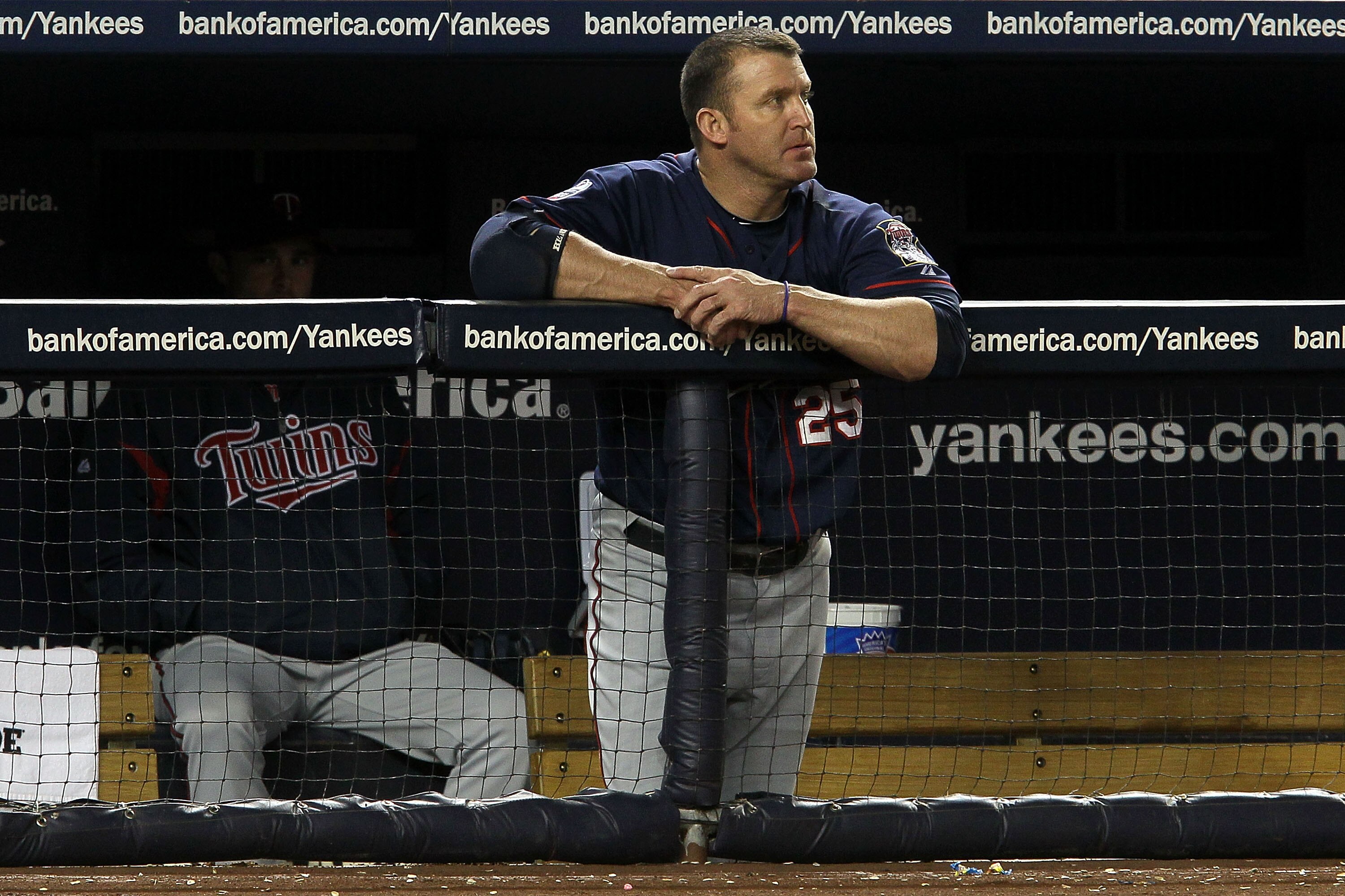 NEW YORK - OCTOBER 09:  Jim Thome #25 of the Minnesota Twins looks on dejected from the dugout against the New York Yankees  during Game Three of the ALDS part of the 2010 MLB Playoffs at Yankee Stadium on October 9, 2010 in the Bronx borough of New York
