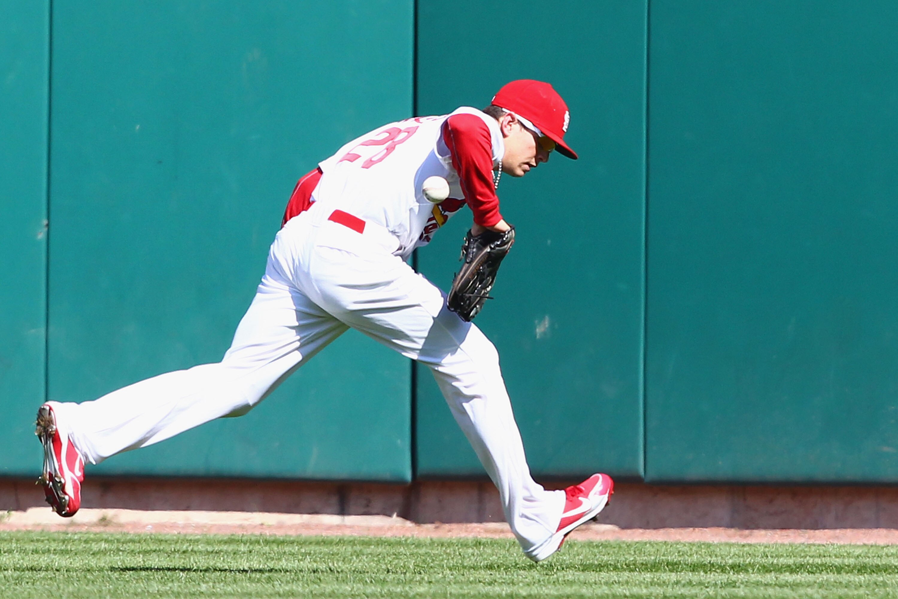 ST. LOUIS - OCTOBER 2: Colby Rasmus #28 of the St. Louis Cardinals misplays a fly ball against the Colorado Rockies at Busch Stadium on October 2, 2010 in St. Louis, Missouri.  The Cardinals beat the Rockies 1-0 in 11 innings.  (Photo by Dilip Vishwanat/G