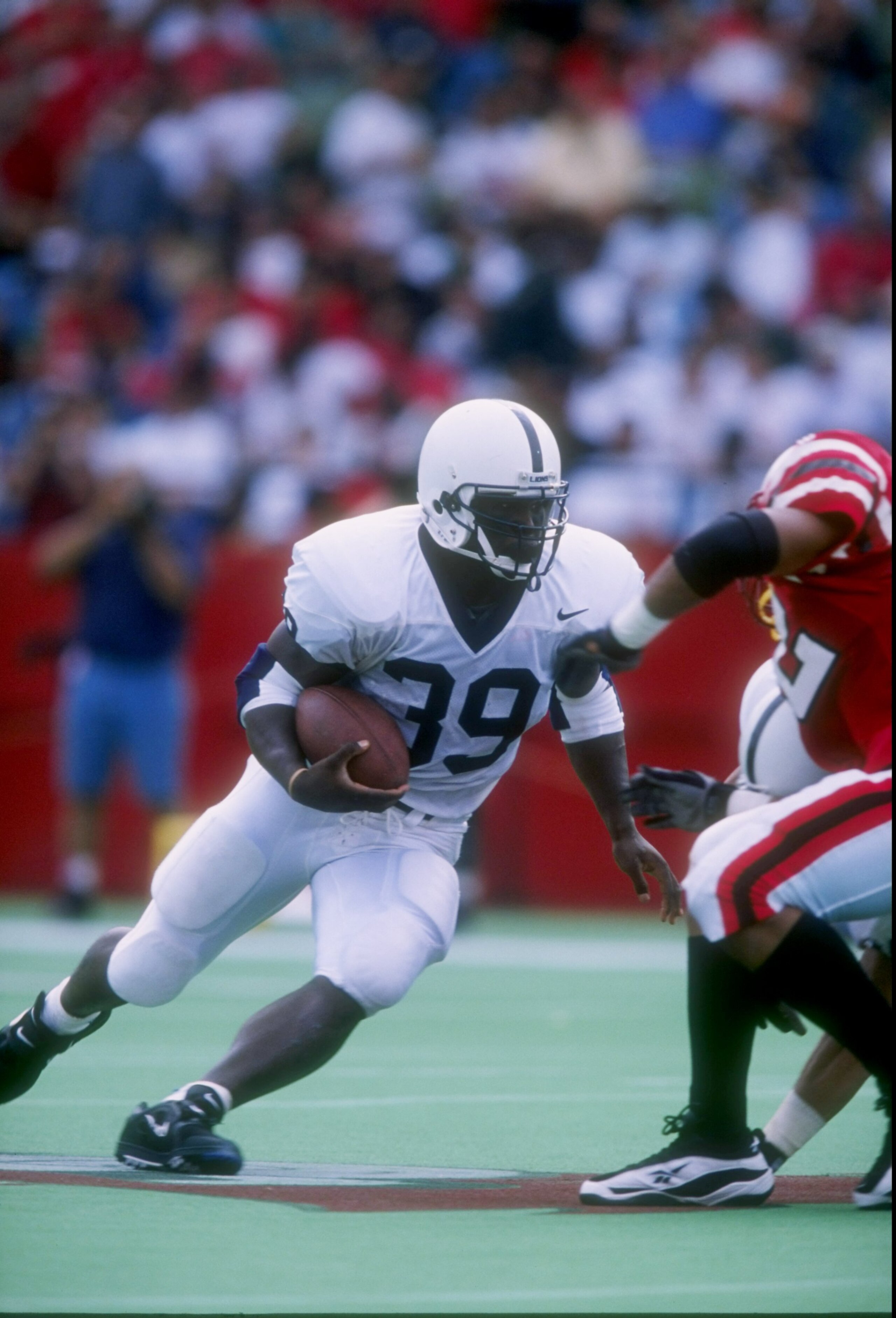 20 Sep 1997: Tailback Curtis Enis of the Penn State Nittany Lions runs down the field during a game against the Louisville Cardinals at Cardinal Stadium in Louisville, Kentucky. Penn State won the game 50-14