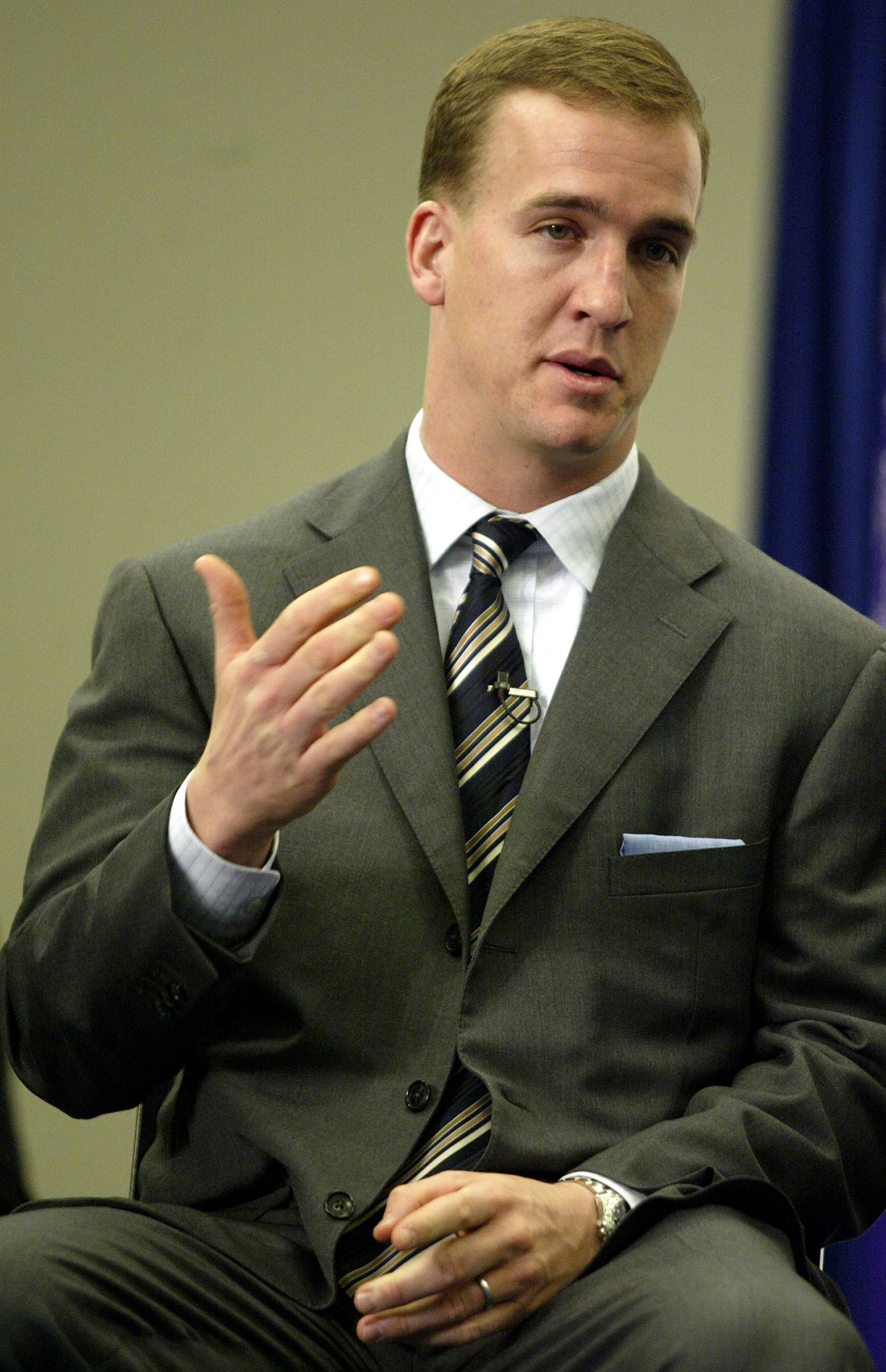 HOUSTON - JANUARY 28:  Quarterback Peyton Manning of the Indianapolis Colts gestures as he talks with the media after being chosen as the FedEx Express NFL Player of the Year during Super Bowl XXXVIII week on January 28, 2003 at the George R. Brown Conven