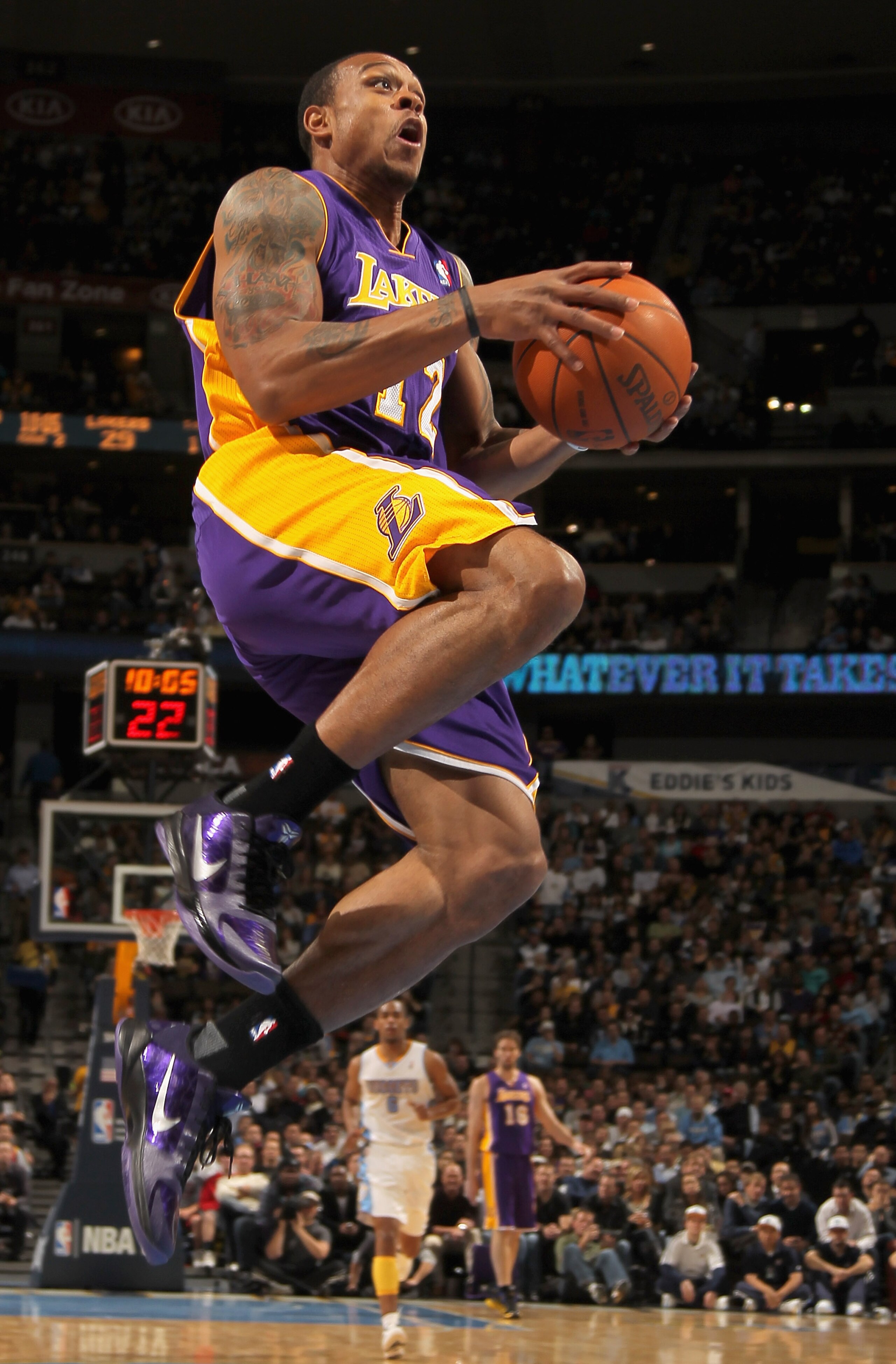 DENVER - NOVEMBER 11:  Shannon Brown #12 of the Los Angeles Lakers lays up a shot against the Denver Nuggets at the Pepsi Center on November 11, 2010 in Denver, Colorado. The Nuggets defeated the Lakers 118-112.  NOTE TO USER: User expressly acknowledges