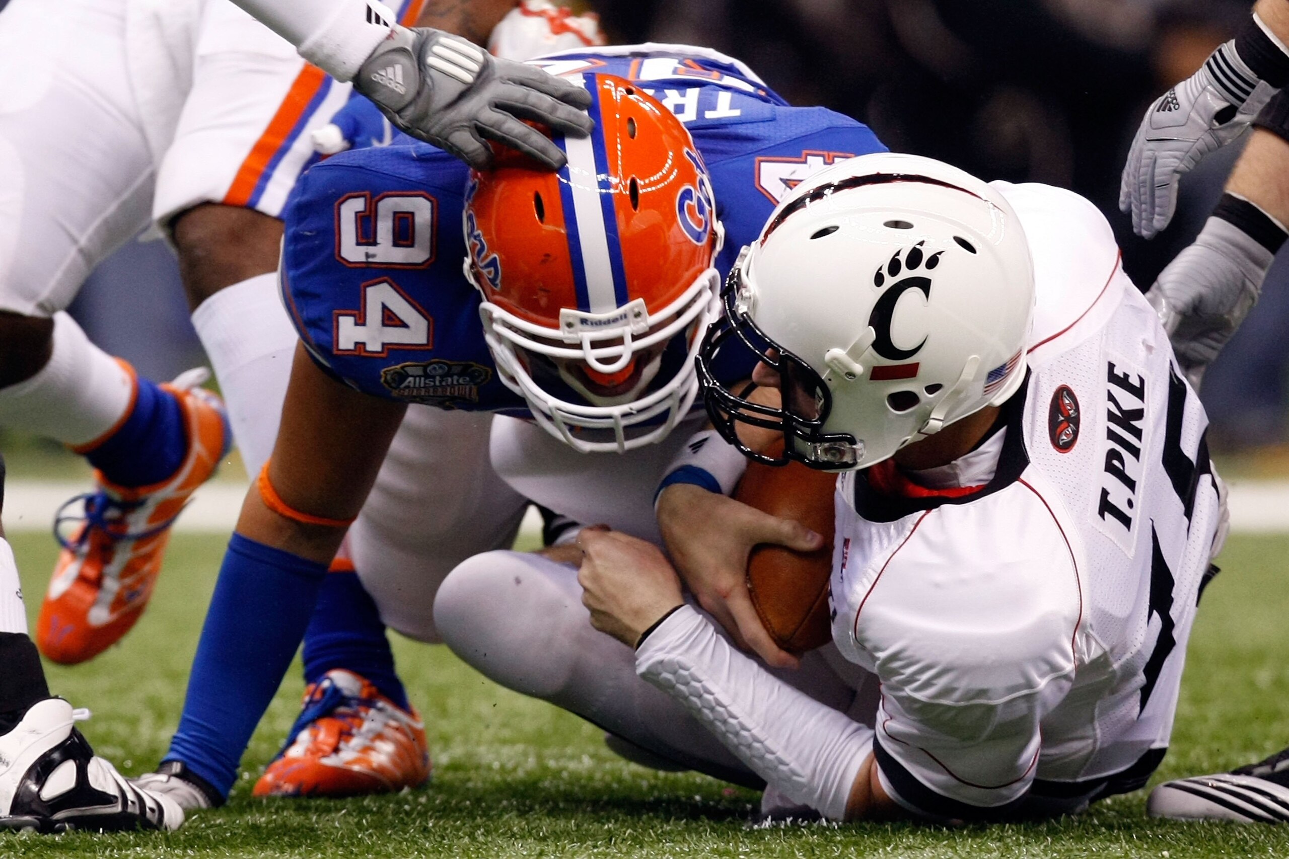 NEW ORLEANS - JANUARY 01: Justin Trattou #94 of the Florida Gators sacks quarterback Tony Pike #15 of the Cincinnati Bearcats during the Allstate Sugar Bowl at the Louisana Superdome on January 1, 2010 in New Orleans, Louisiana.  (Photo by Kevin C. Cox/Ge
