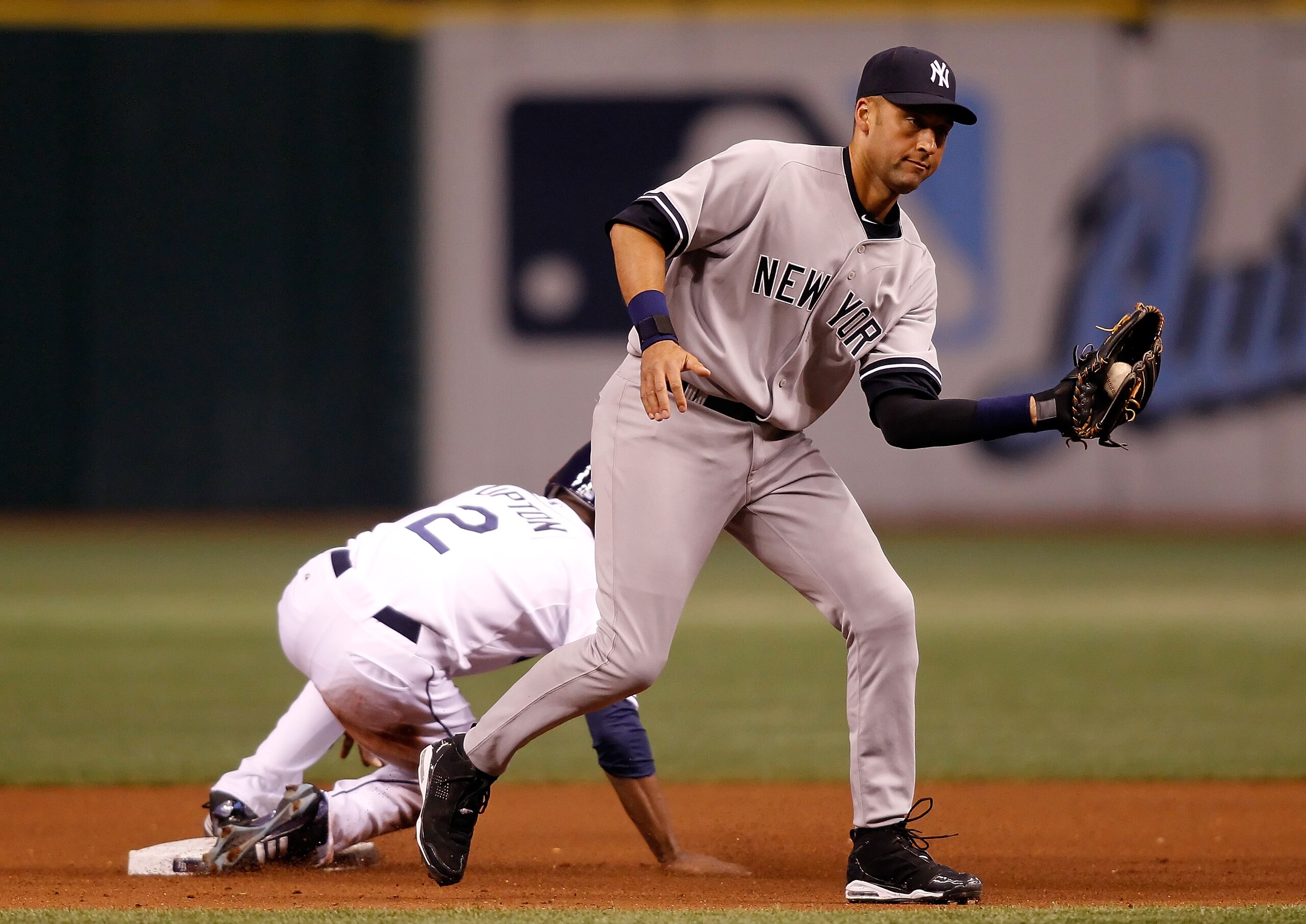 ST. PETERSBURG - APRIL 09: Outfielder B.J. Upton #2 of the Tampa Bay Rays steals second as shortstop Derek Jeter #2 of the New York Yankees takes the throw during the game at Tropicana Field on April 9, 2010 in St. Petersburg, Florida. (Photo by J. Meri ST. PETERSBURG - APRIL 09: Outfielder B.J. Upton #2 of the Tampa Bay Rays steals second as shortstop Derek Jeter #2 of the New York Yankees takes the throw during the game at Tropicana Field on April 9, 2010 in St. Petersburg, Florida. (Photo by J. Meri