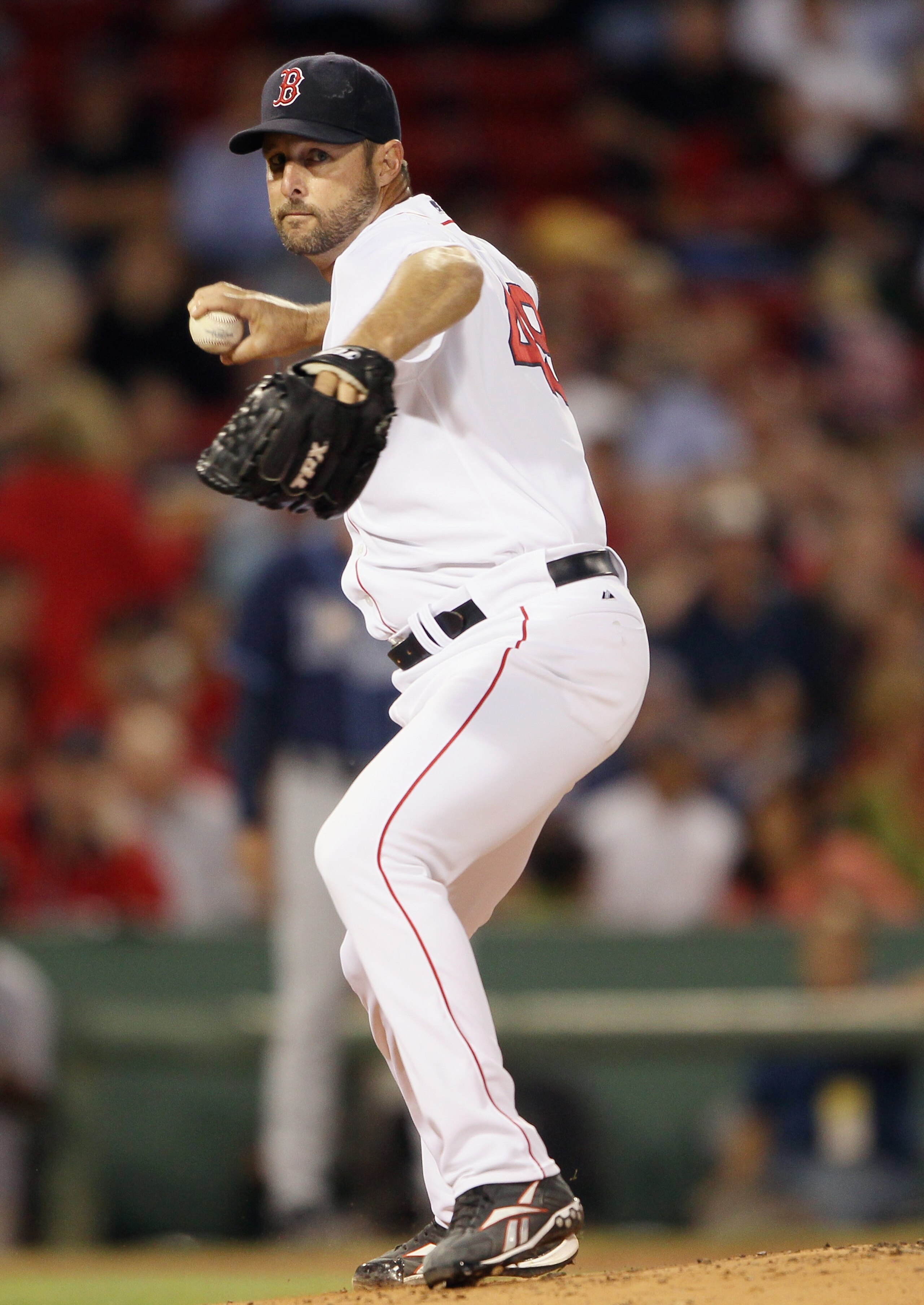 BOSTON - SEPTEMBER 08: Tim Wakefield #49 of the Boston Red Sox sends the ball to first base in an attempt to catch Ben Zobrist of the Tampa Bay Rays leading off on September 8, 2010 at Fenway Park in Boston, Massachusetts. (Photo by Elsa/Getty Images) BOSTON - SEPTEMBER 08: Tim Wakefield #49 of the Boston Red Sox sends the ball to first base in an attempt to catch Ben Zobrist of the Tampa Bay Rays leading off on September 8, 2010 at Fenway Park in Boston, Massachusetts. (Photo by Elsa/Getty Images)