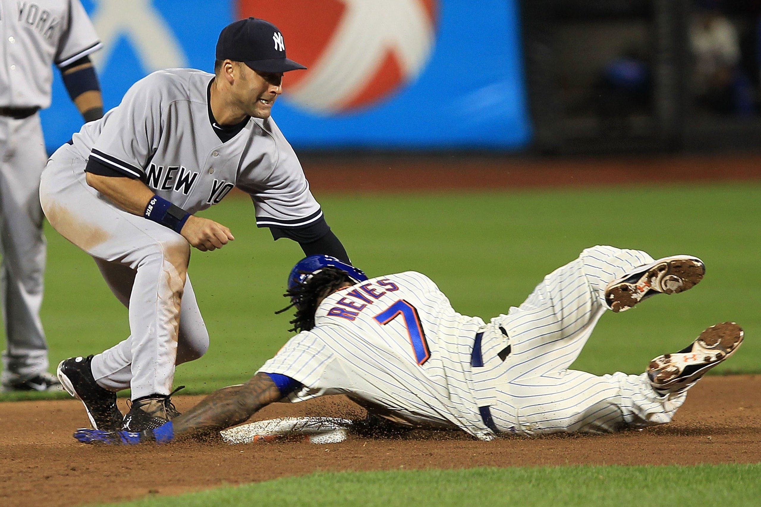 NEW YORK - MAY 22: Derek Jeter #2 of the New York Yankees tags out Jose Reyes #7 of the New York Mets at second base on May 22, 2010 at Citi Field in the Flushing neighborhood of the Queens borough of New York City. (Photo by Chris McGrath/Getty Images) NEW YORK - MAY 22: Derek Jeter #2 of the New York Yankees tags out Jose Reyes #7 of the New York Mets at second base on May 22, 2010 at Citi Field in the Flushing neighborhood of the Queens borough of New York City. (Photo by Chris McGrath/Getty Images)