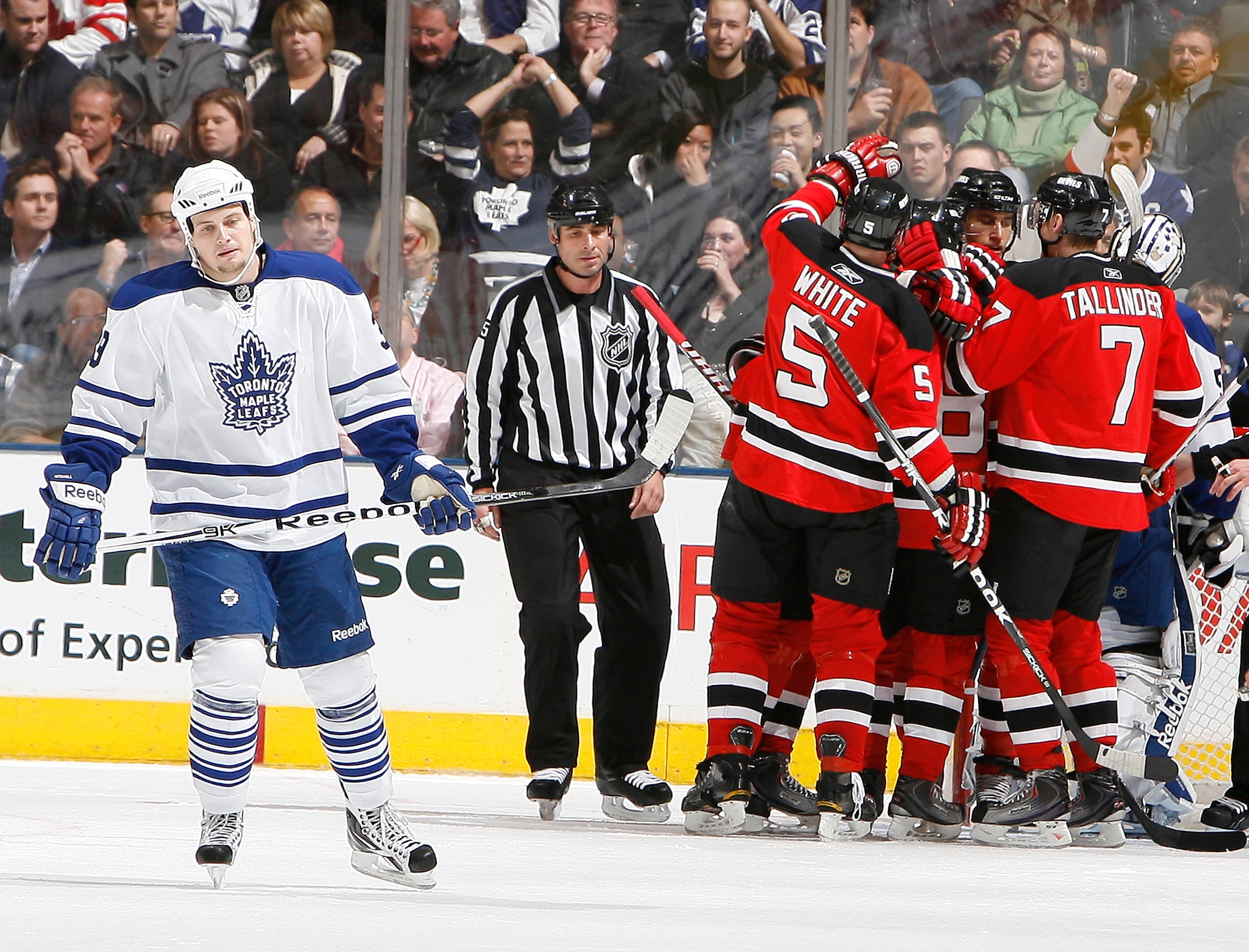 TORONTO - NOVEMBER 18: John Mitchell #39 of the Toronto Maple Leafs skates away as the New Jersey Devils celebrate goal during game action at the Air Canada Centre November 18, 2010 in Toronto, Ontario, Canada. (Photo by Abelimages/Getty Images)