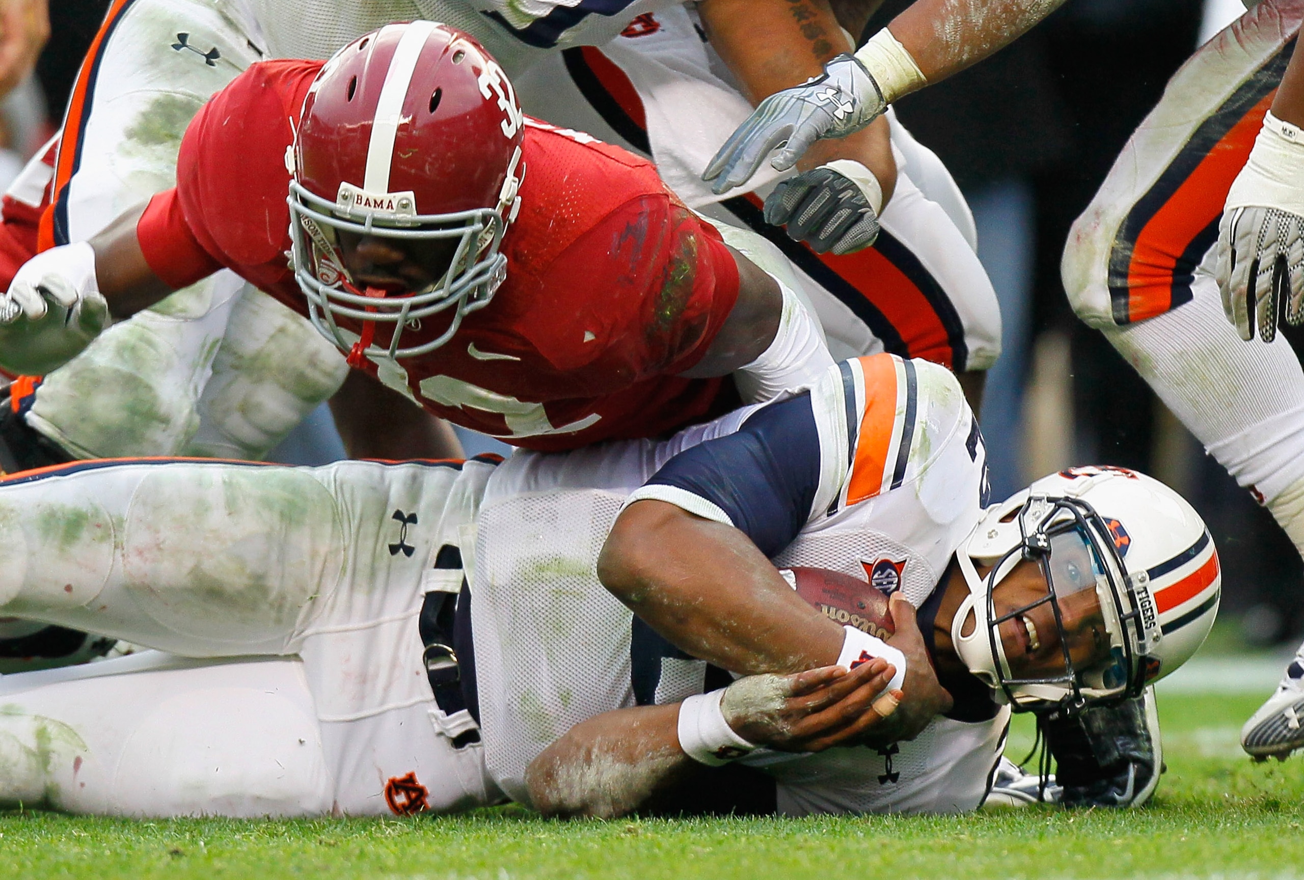 TUSCALOOSA, AL - NOVEMBER 26: Quarterback Cam Newton #2 of the Auburn Tigers dives on the ground for more yardage against C.J. Mosley #32 of the Alabama Crimson Tide at Bryant-Denny Stadium on November 26, 2010 in Tuscaloosa, Alabama. (Photo by Kevin C. TUSCALOOSA, AL - NOVEMBER 26: Quarterback Cam Newton #2 of the Auburn Tigers dives on the ground for more yardage against C.J. Mosley #32 of the Alabama Crimson Tide at Bryant-Denny Stadium on November 26, 2010 in Tuscaloosa, Alabama. (Photo by Kevin C.