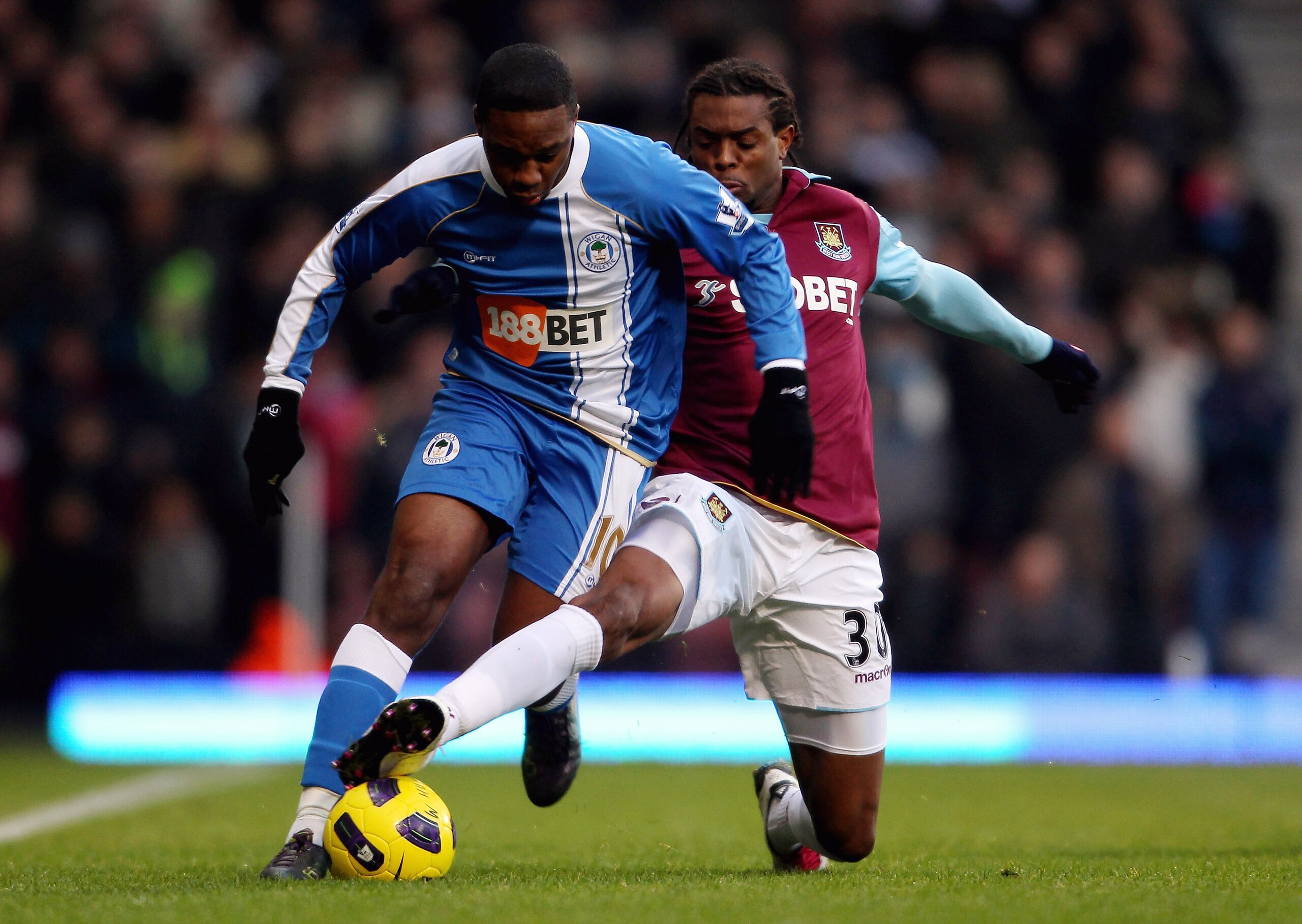 LONDON, ENGLAND - NOVEMBER 27: West Ham's Frederic Piquionne (R) in action with Wigan's Charles N'Zogbia during the Barclays Premier League match between West Ham United and Wigan Athletic at Boleyn Ground on November 27, 2010 in London, England.  (Photo