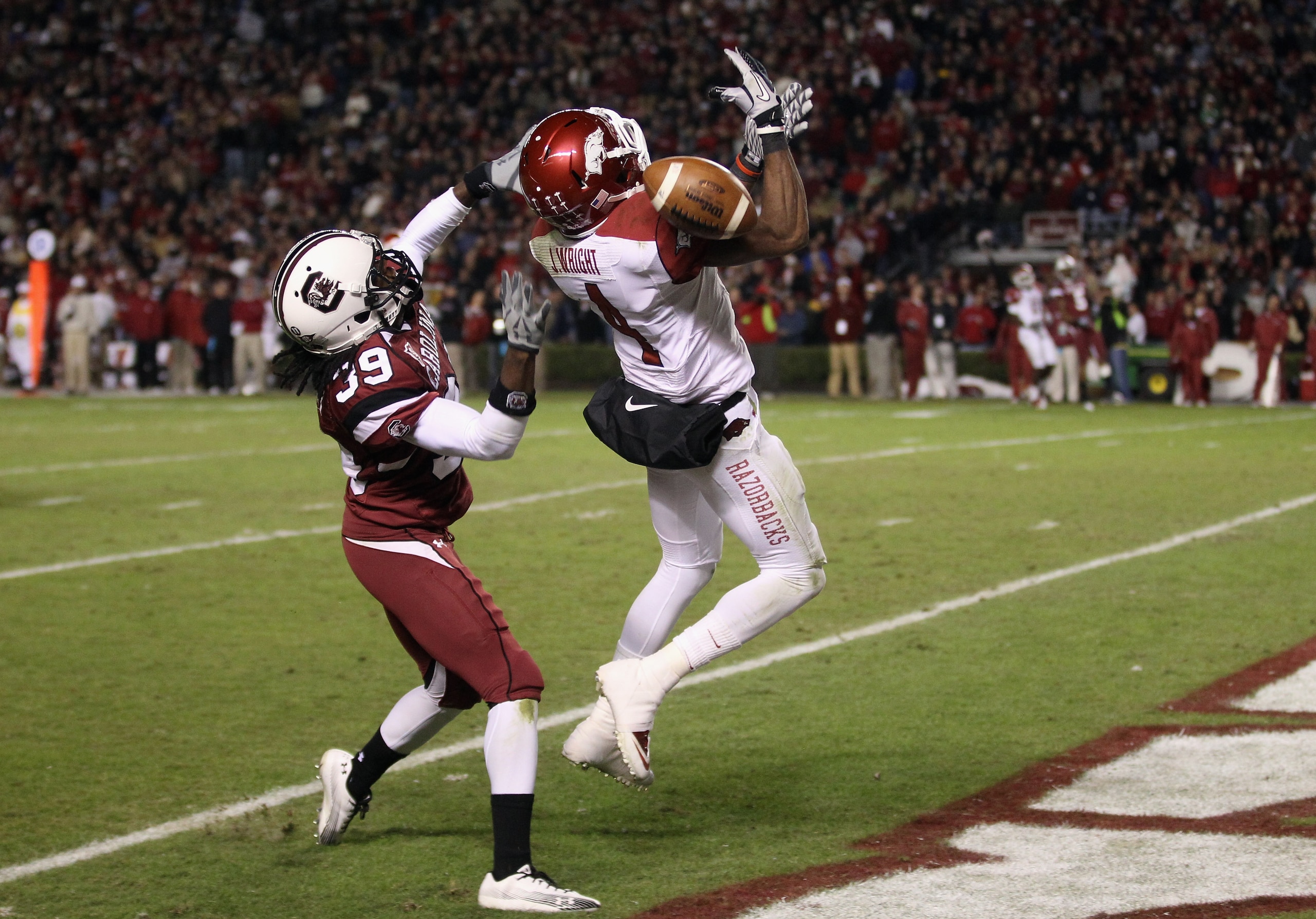 COLUMBIA, SC - NOVEMBER 06: Jarius Wright #4 of the Arkansas Razorbacks has a pass broken up by Marty Markett #39 of the South Carolina Gamecocks during their game at Williams-Brice Stadium on November 6, 2010 in Columbia, South Carolina. (Photo by Stre COLUMBIA, SC - NOVEMBER 06: Jarius Wright #4 of the Arkansas Razorbacks has a pass broken up by Marty Markett #39 of the South Carolina Gamecocks during their game at Williams-Brice Stadium on November 6, 2010 in Columbia, South Carolina. (Photo by Stre