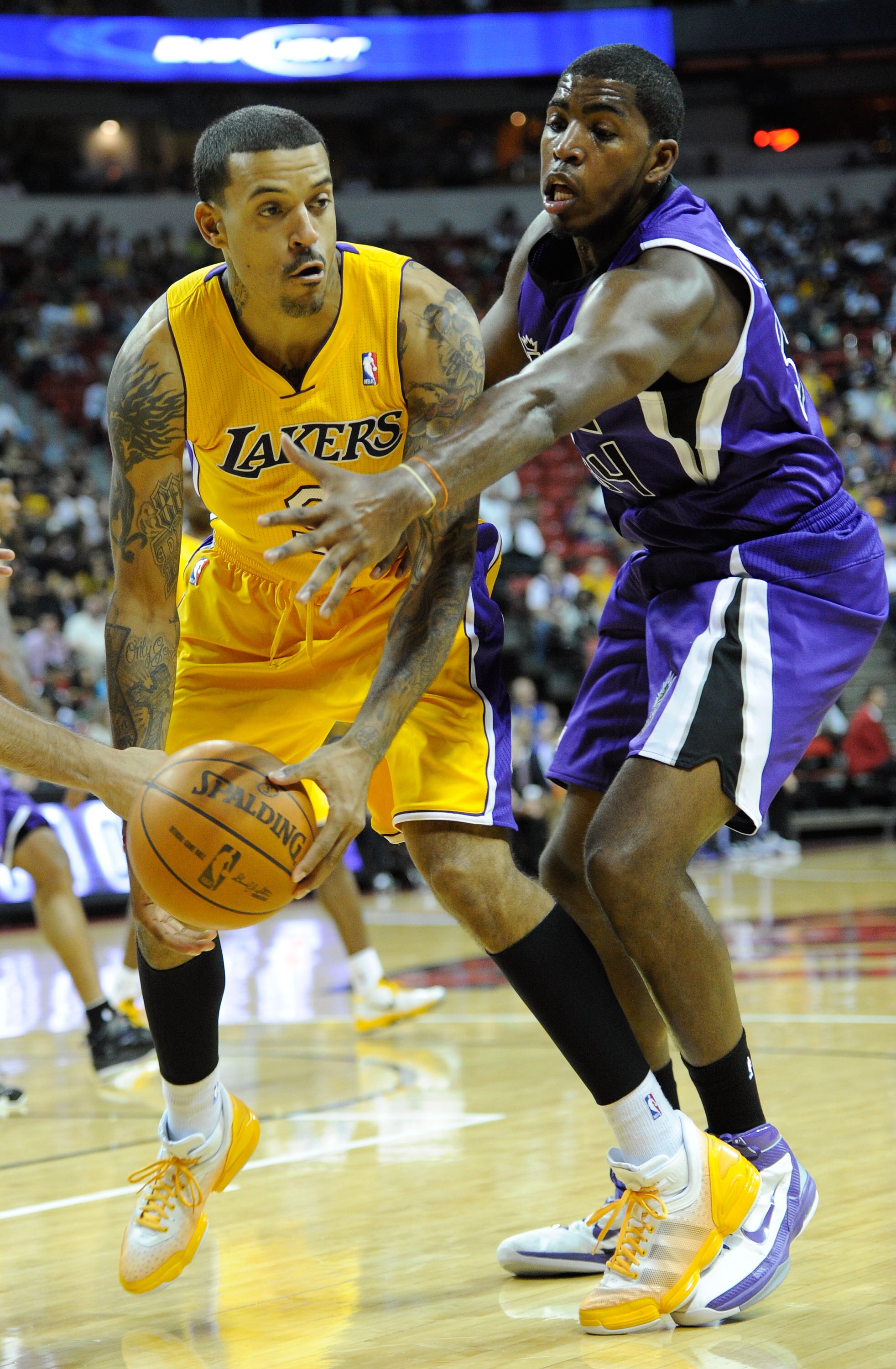 LAS VEGAS - OCTOBER 13:  Matt Barnes #9 of the Los Angeles Lakers and Jason Thompson #34 of the Sacramento Kings go for a loose ball during their preseason game at the Thomas & Mack Center October 13, 2010 in Las Vegas, Nevada. The Lakers won 98-95. NOTE