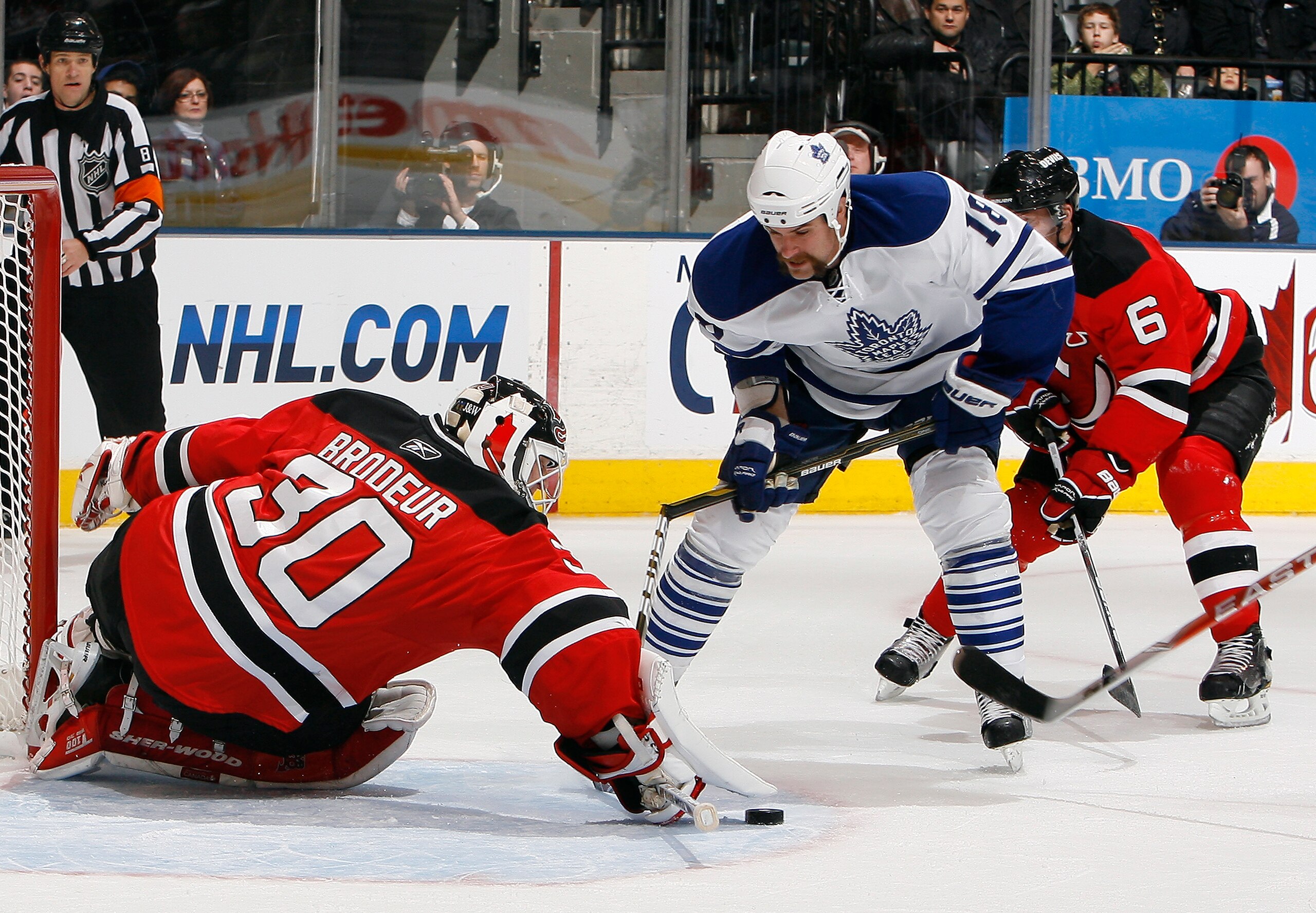 TORONTO - NOVEMBER 18: Mike Brown #18 of the Toronto Maple Leafs breaks his stick while getting around Martin Brodeur #30 of the New Jersey Devils during game action at the Air Canada Centre November 18, 2010 in Toronto, Ontario, Canada. (Photo by Abelima
