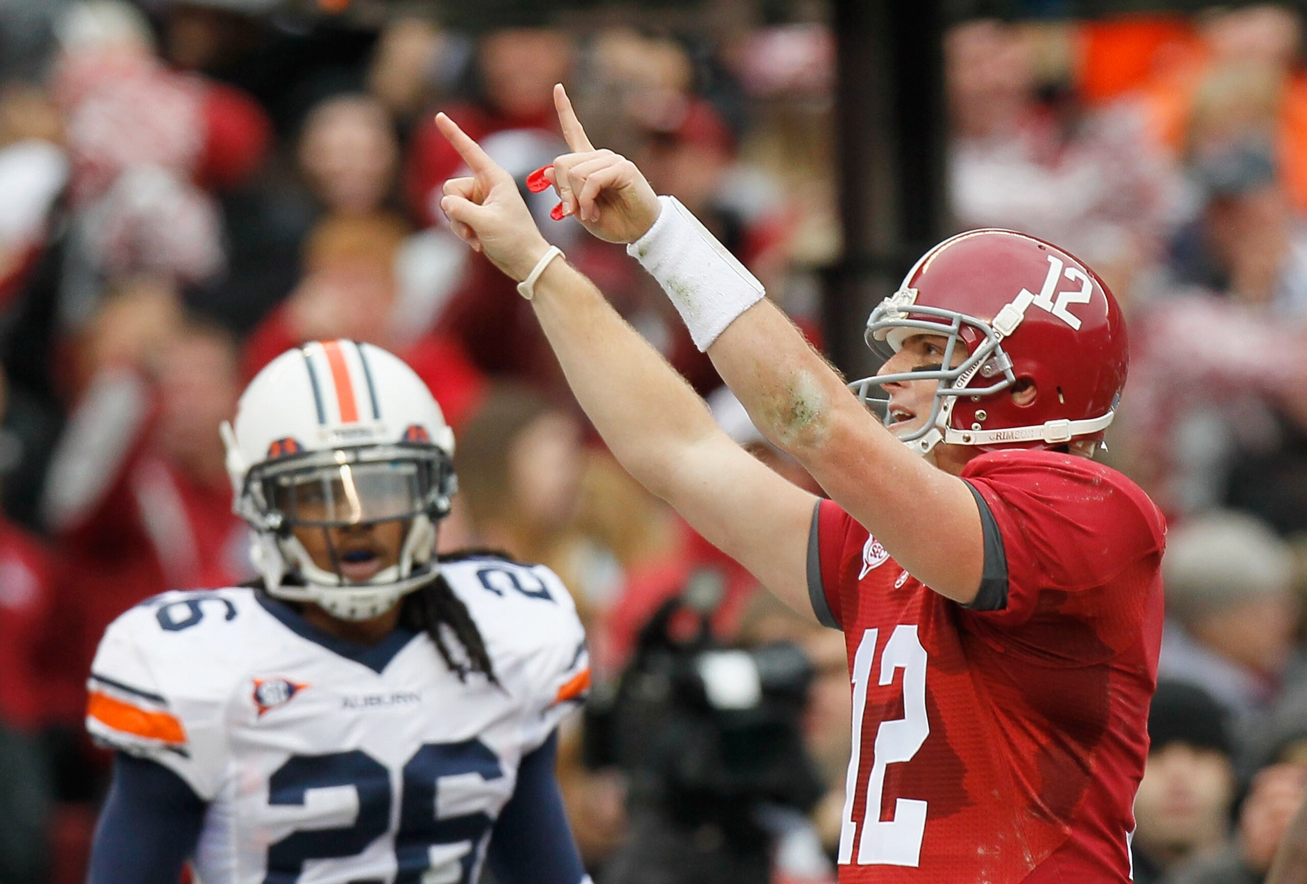 TUSCALOOSA, AL - NOVEMBER 26: Quarterback Greg McElroy #12 of the Alabama Crimson Tide reacts a throwing for a touchdown against the Auburn Tigers at Bryant-Denny Stadium on November 26, 2010 in Tuscaloosa, Alabama. (Photo by Kevin C. Cox/Getty Images) TUSCALOOSA, AL - NOVEMBER 26: Quarterback Greg McElroy #12 of the Alabama Crimson Tide reacts a throwing for a touchdown against the Auburn Tigers at Bryant-Denny Stadium on November 26, 2010 in Tuscaloosa, Alabama. (Photo by Kevin C. Cox/Getty Images)