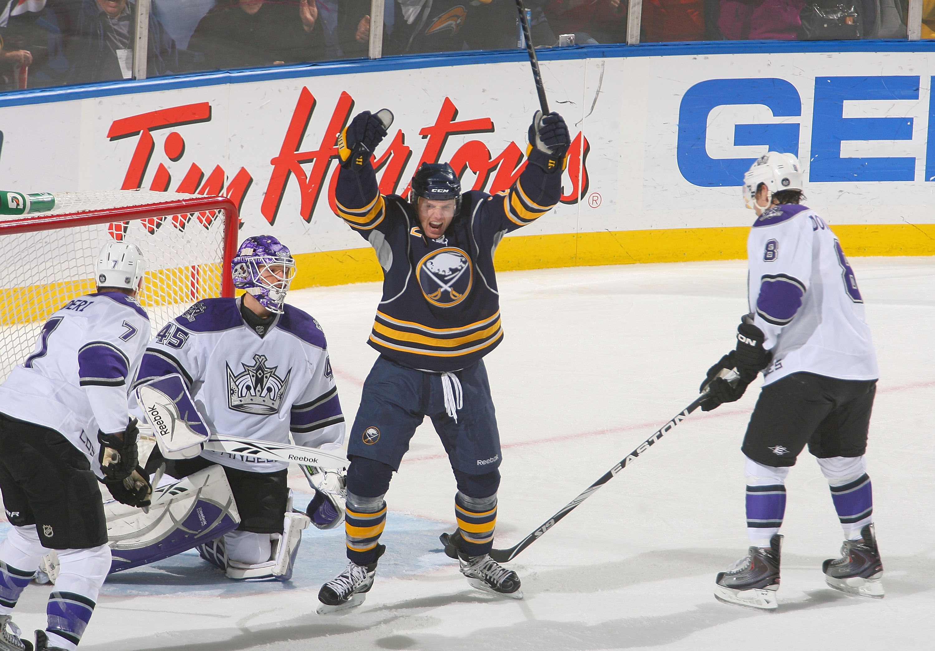 BUFFALO, NY - NOVEMBER 19: Thomas Vanek #26 of the Buffalo Sabres celebrates a goal by teammate Derek Roy #9 (not shown) against Rob Scuderi #7, Jonathan Bernier #45 and Drew Doughty #8 of the Los Angeles Kings at HSBC Arena on November 19, 2010 in Buffal