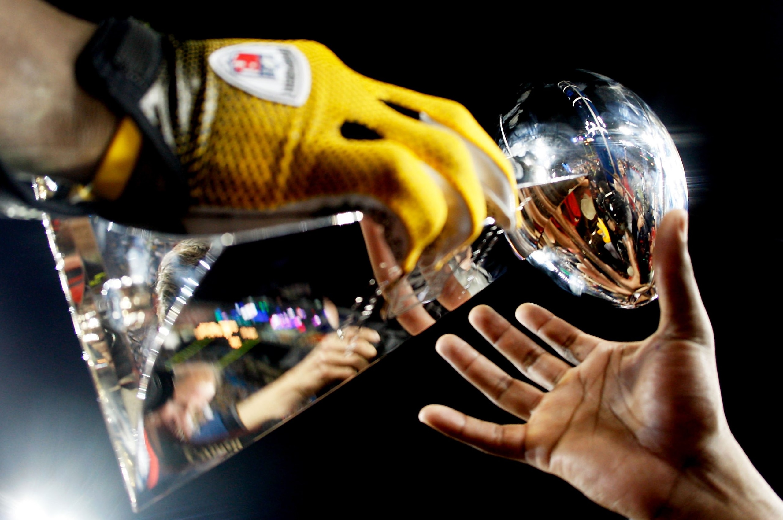 TAMPA, FL - FEBRUARY 01:  Players from the Pittsburgh Steelers celebrate with the Vince Lombardi trophy after their 27-23 win against the Arizona Cardinals during Super Bowl XLIII on February 1, 2009 at Raymond James Stadium in Tampa, Florida.  (Photo by