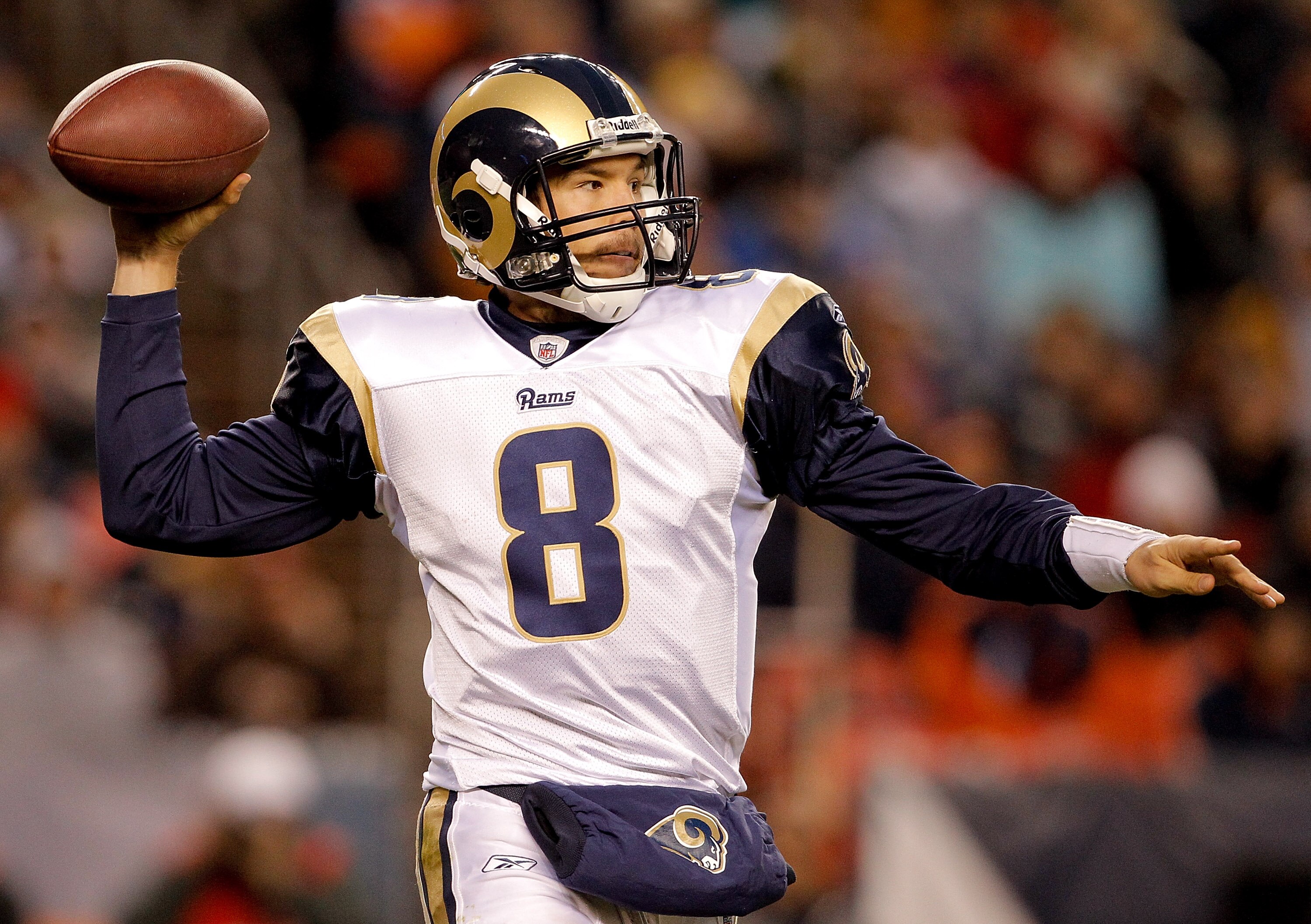 DENVER - NOVEMBER 28:  Quarterback Sam Bradford #8 of the St. Louis Rams makes a pass during the third quarter against the Denver Broncos at INVESCO Field at Mile High on November 28, 2010 in Denver, Colorado. The Rams defeated the Broncos 36-33. (Photo b