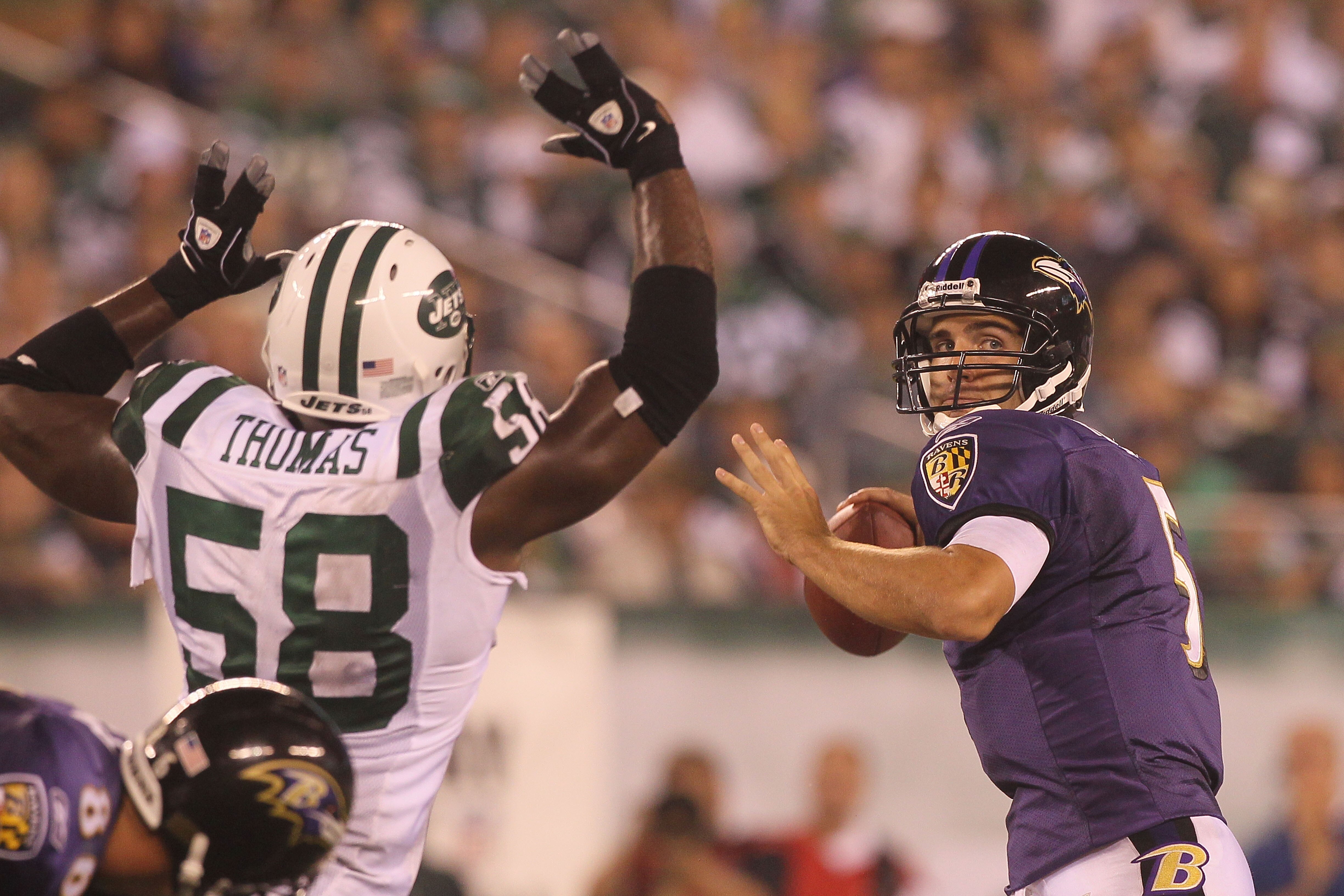 EAST RUTHERFORD, NJ - SEPTEMBER 13:  Joe Flacco #5 of the Baltimore Ravens in action against the New York Jets during the home opener at the New Meadowlands Stadium on September 13, 2010 in East Rutherford, New Jersey.  (Photo by Jim McIsaac/Getty Images)