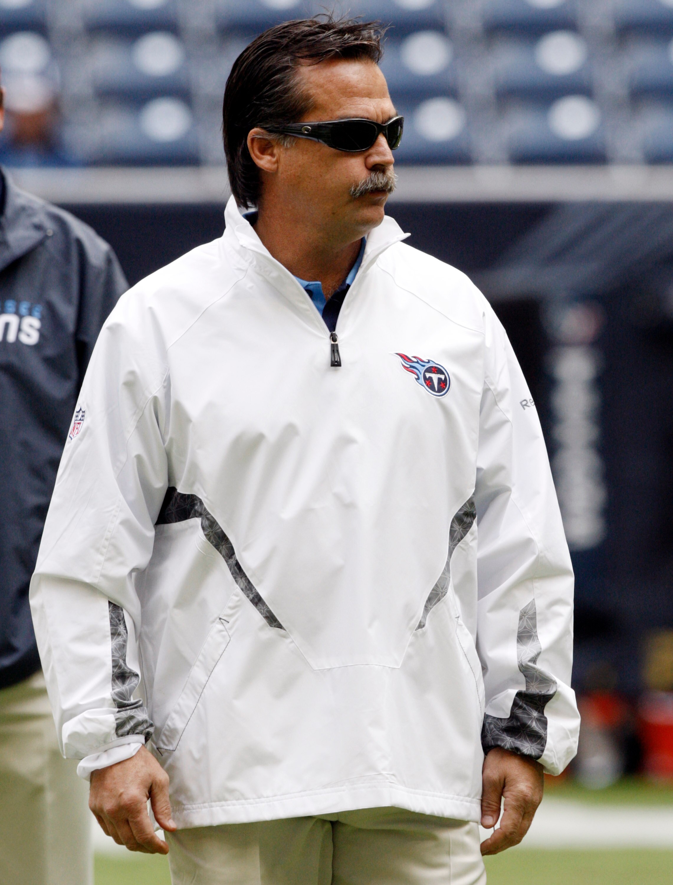 HOUSTON - NOVEMBER 28:  Head coach Jeff Fisher of the Tennessee Titans watches during pre-game warm ups before playing the Houston Texans at Reliant Stadium on November 28, 2010 in Houston, Texas.  (Photo by Bob Levey/Getty Images)