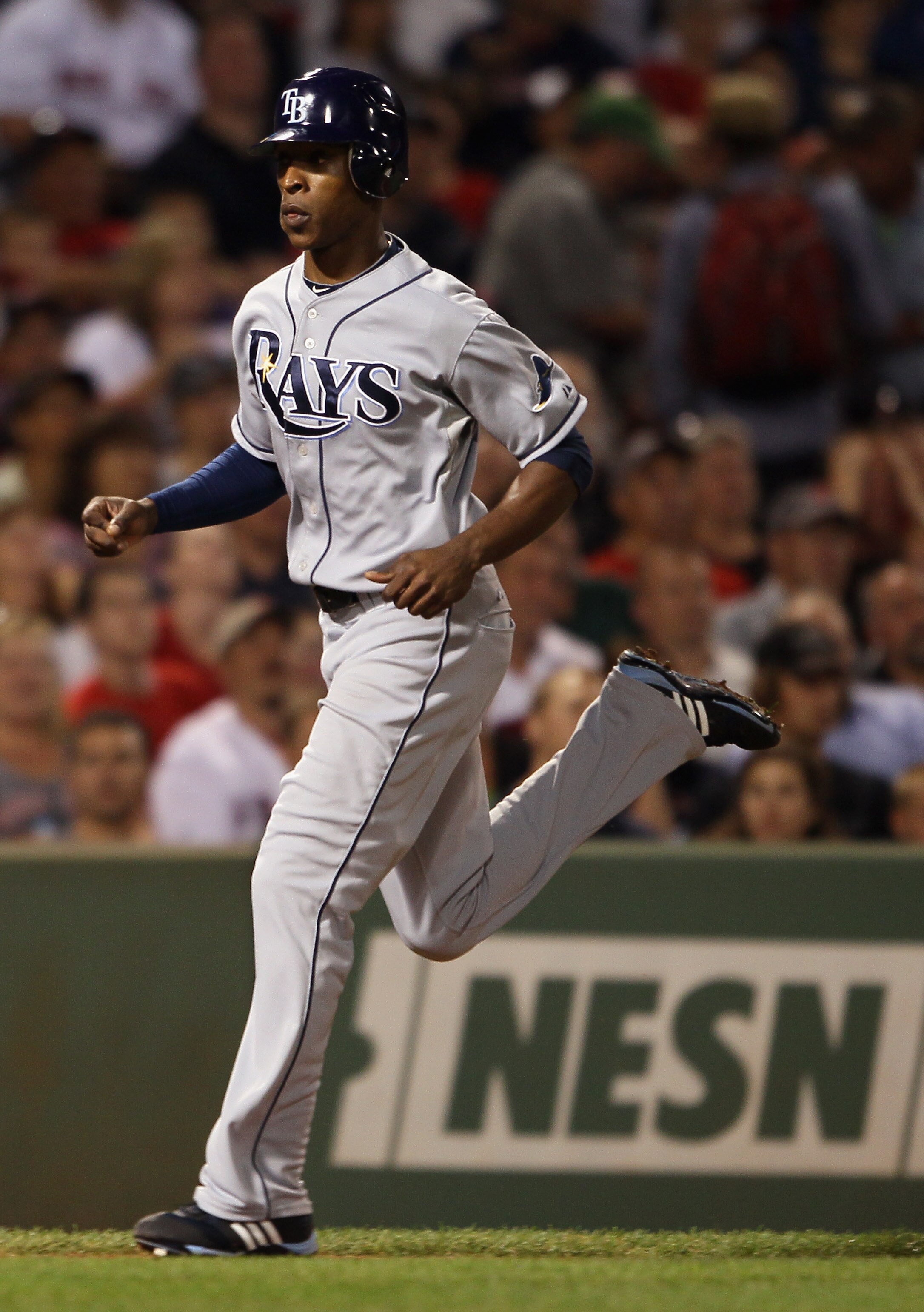 BOSTON - SEPTEMBER 07:  B.J. Upton #2 of the Tampa Bay Rays scores a run in the fourth inning against the Boston Red Sox on September 7, 2010 at Fenway Park in Boston, Massachusetts.  (Photo by Elsa/Getty Images)