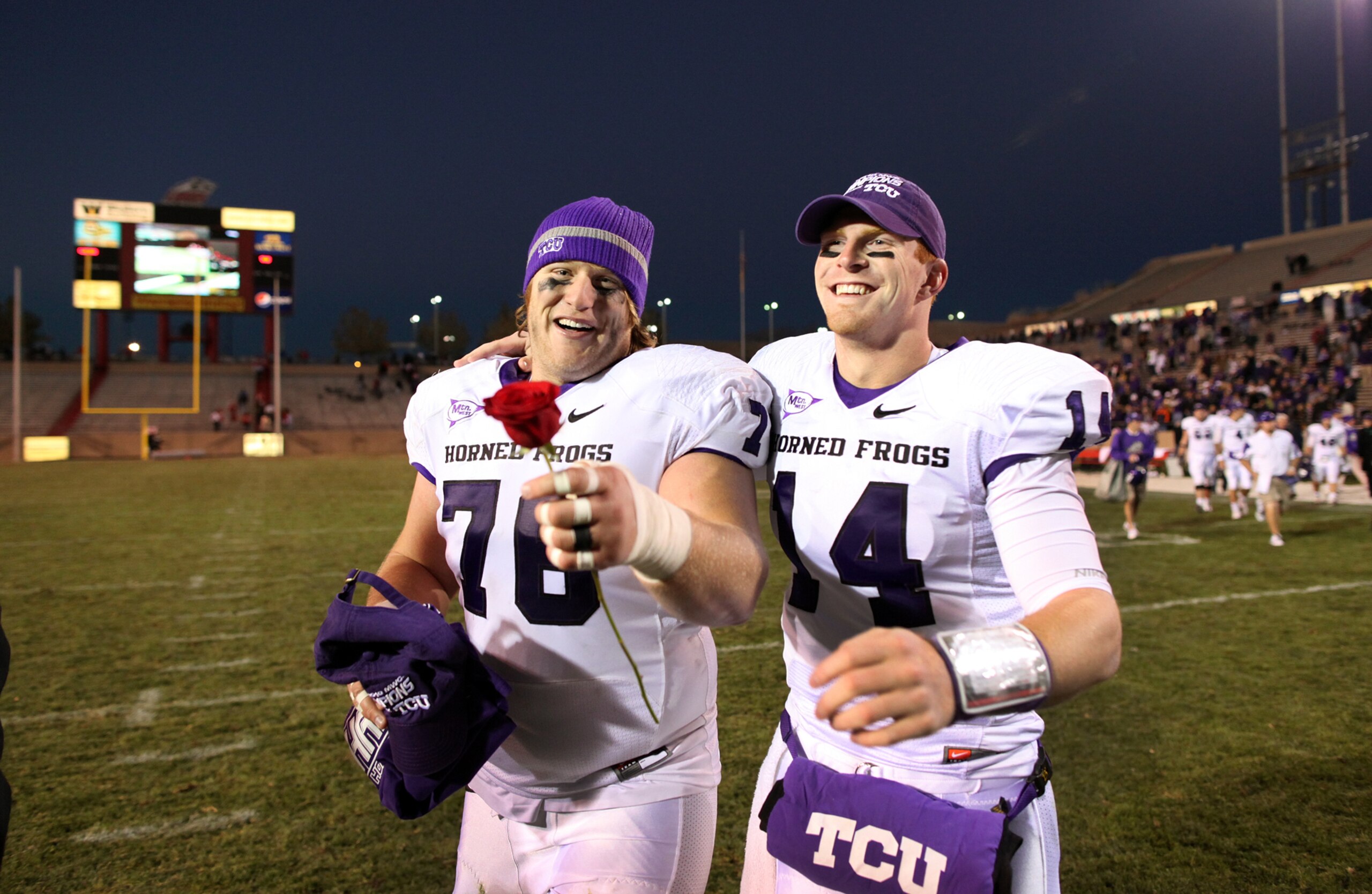 ALBUQUERQUE, NM - NOVEMBER 27: Jake Kirkpatrick #76 and Andy Dalton #14 of the TCU Horned Frogs celebrate the win against the University of New Mexico Lobos on November 27, 2010 at University Stadium in Albuquerque, New Mexico. TCU won 66-17. (Photo by Er ALBUQUERQUE, NM - NOVEMBER 27: Jake Kirkpatrick #76 and Andy Dalton #14 of the TCU Horned Frogs celebrate the win against the University of New Mexico Lobos on November 27, 2010 at University Stadium in Albuquerque, New Mexico. TCU won 66-17. (Photo by Er