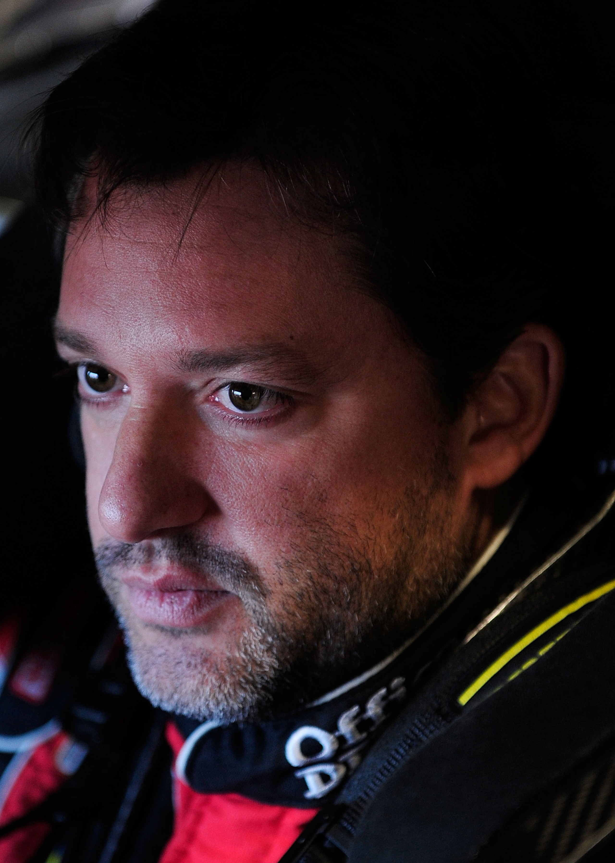 FORT WORTH, TX - NOVEMBER 06:  Tony Stewart, driver of the #14 Old Spice/Office Depot Chevrolet,  sits in his car in the garage area during practice for the NASCAR Sprint Cup Series AAA Texas 500 at Texas Motor Speedway on November 6, 2010 in Fort Worth,