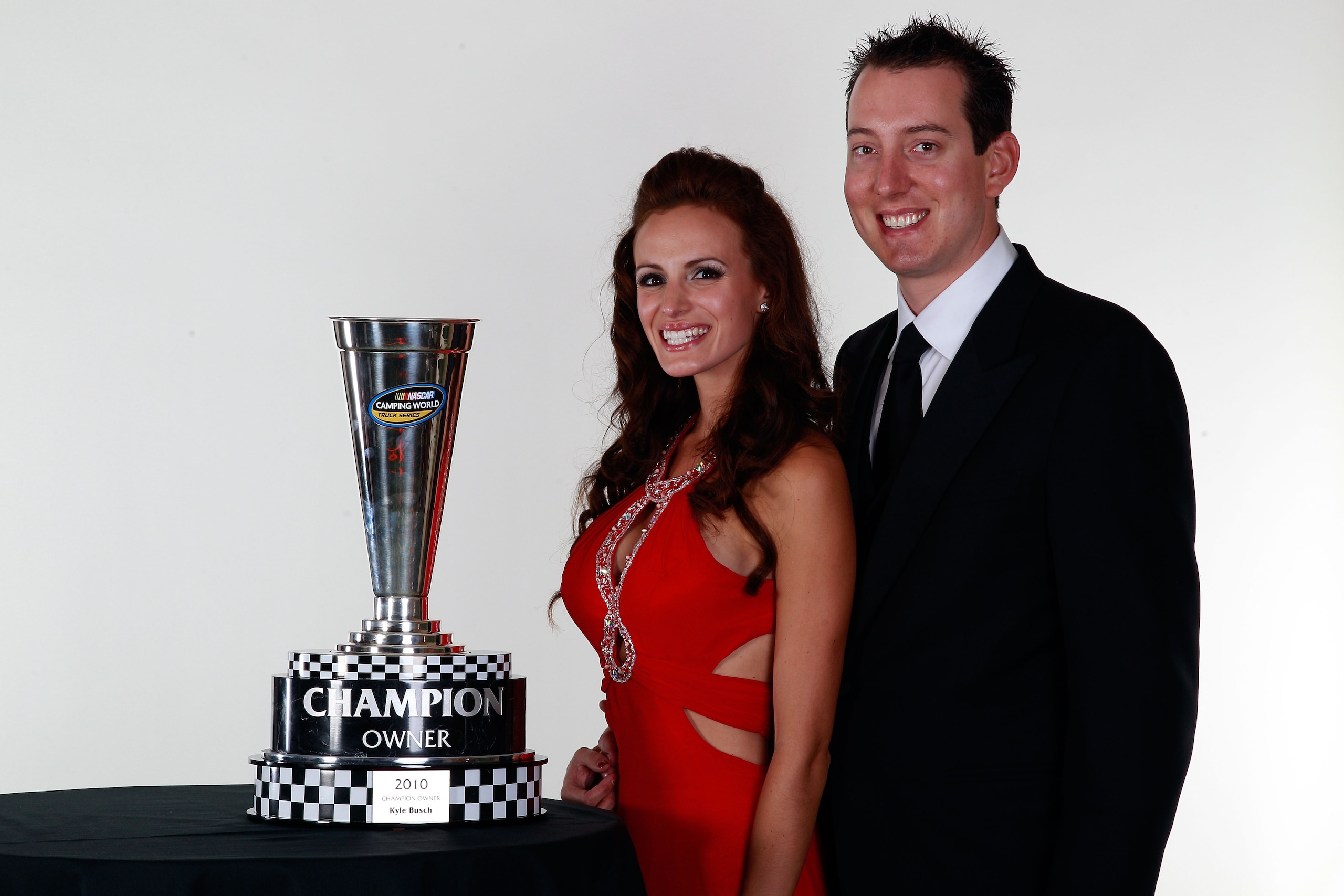 MIAMI - NOVEMBER 22:  2010 Owners Champion Kyle Busch (R), his fiancee Samantha Sarcinella (L), pose during the NASCAR Nationwide/Camping World Truck Series Banquet at Loews Miami Beach Hotel on November 22, 2010 in Miami, Florida.  (Photo by Chris Grayth