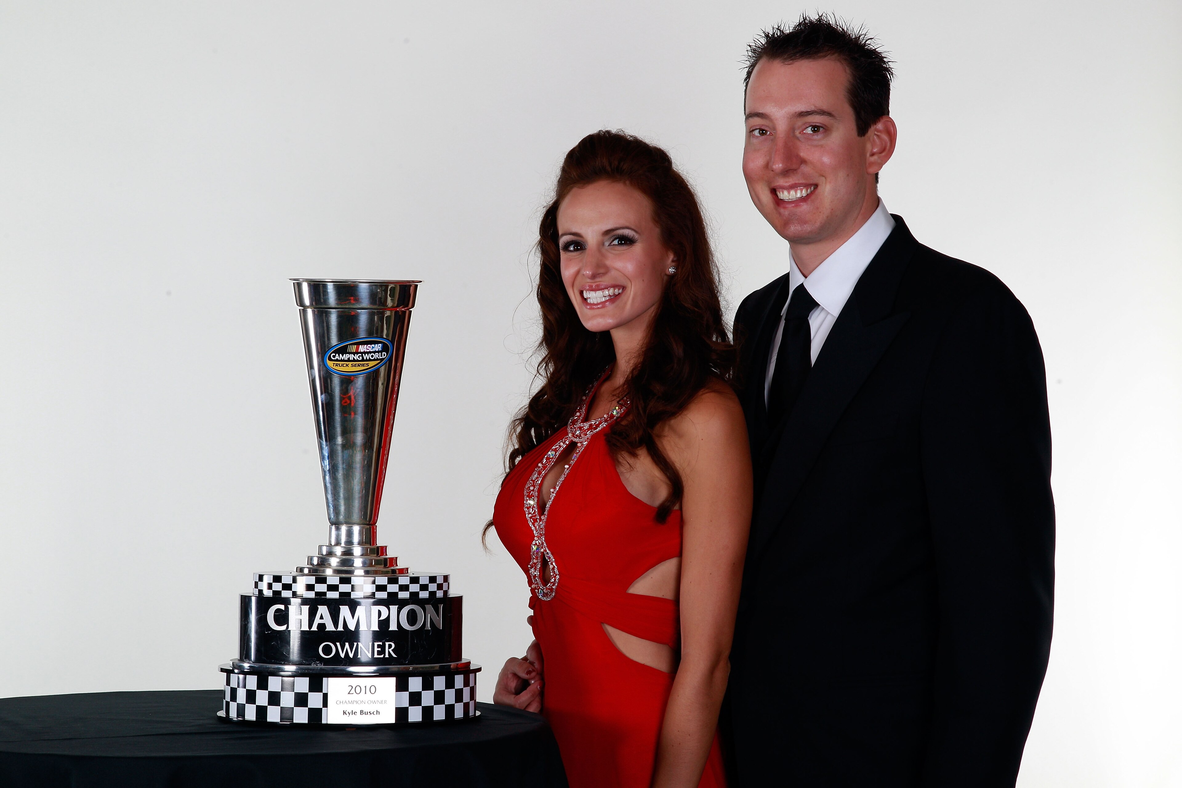 MIAMI - NOVEMBER 22:  2010 Owners Champion Kyle Busch (R), his fiancee Samantha Sarcinella (L), pose during the NASCAR Nationwide/Camping World Truck Series Banquet at Loews Miami Beach Hotel on November 22, 2010 in Miami, Florida.  (Photo by Chris Grayth