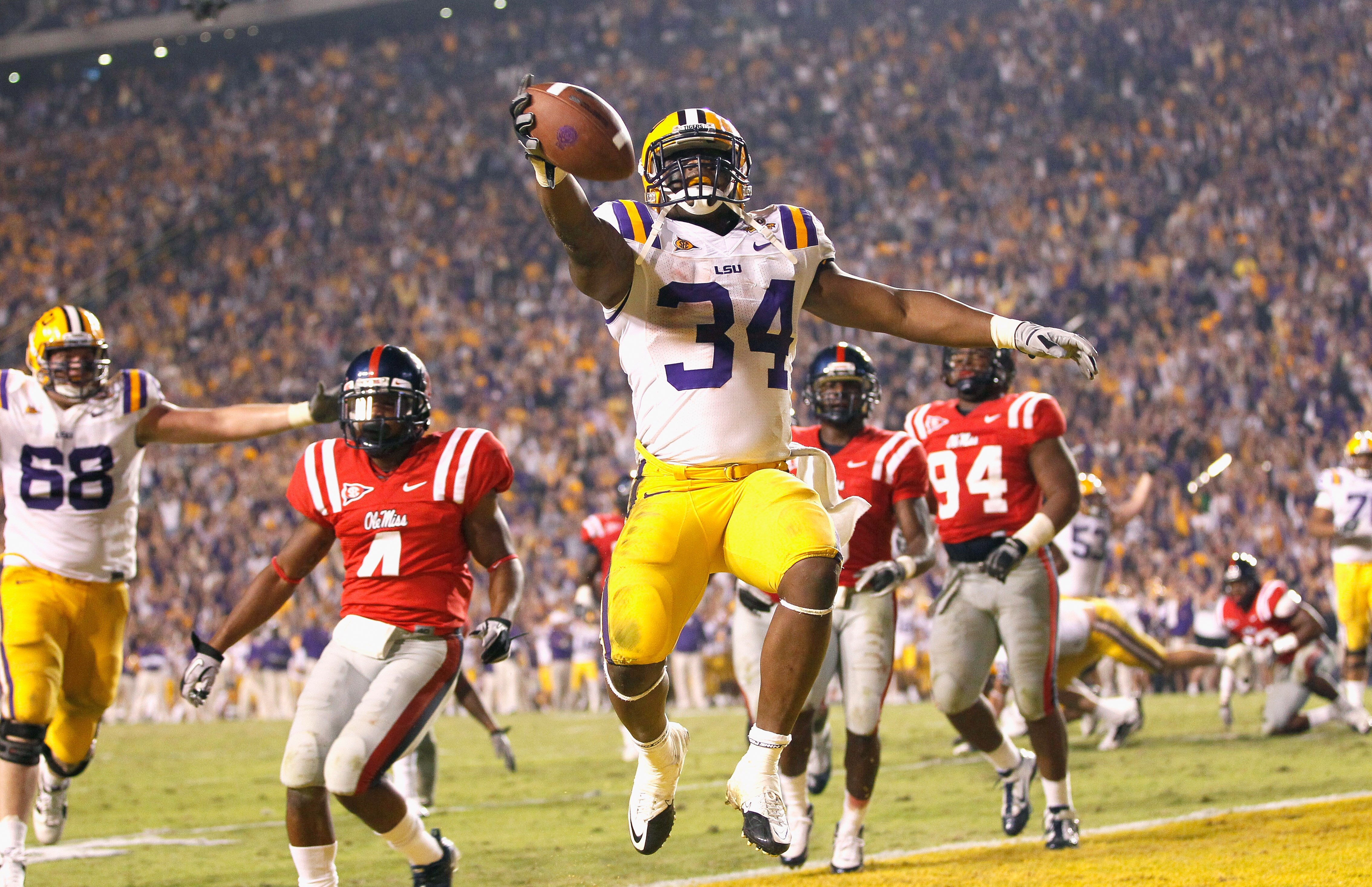 BATON ROUGE, LA - NOVEMBER 20:  Stevan Ridley #34 of the Louisiana State University Tigers scores the go-ahead toucdown in the final minutes of the fourth quarter against the Ole Miss Rebels at Tiger Stadium on November 20, 2010 in Baton Rouge, Louisiana.
