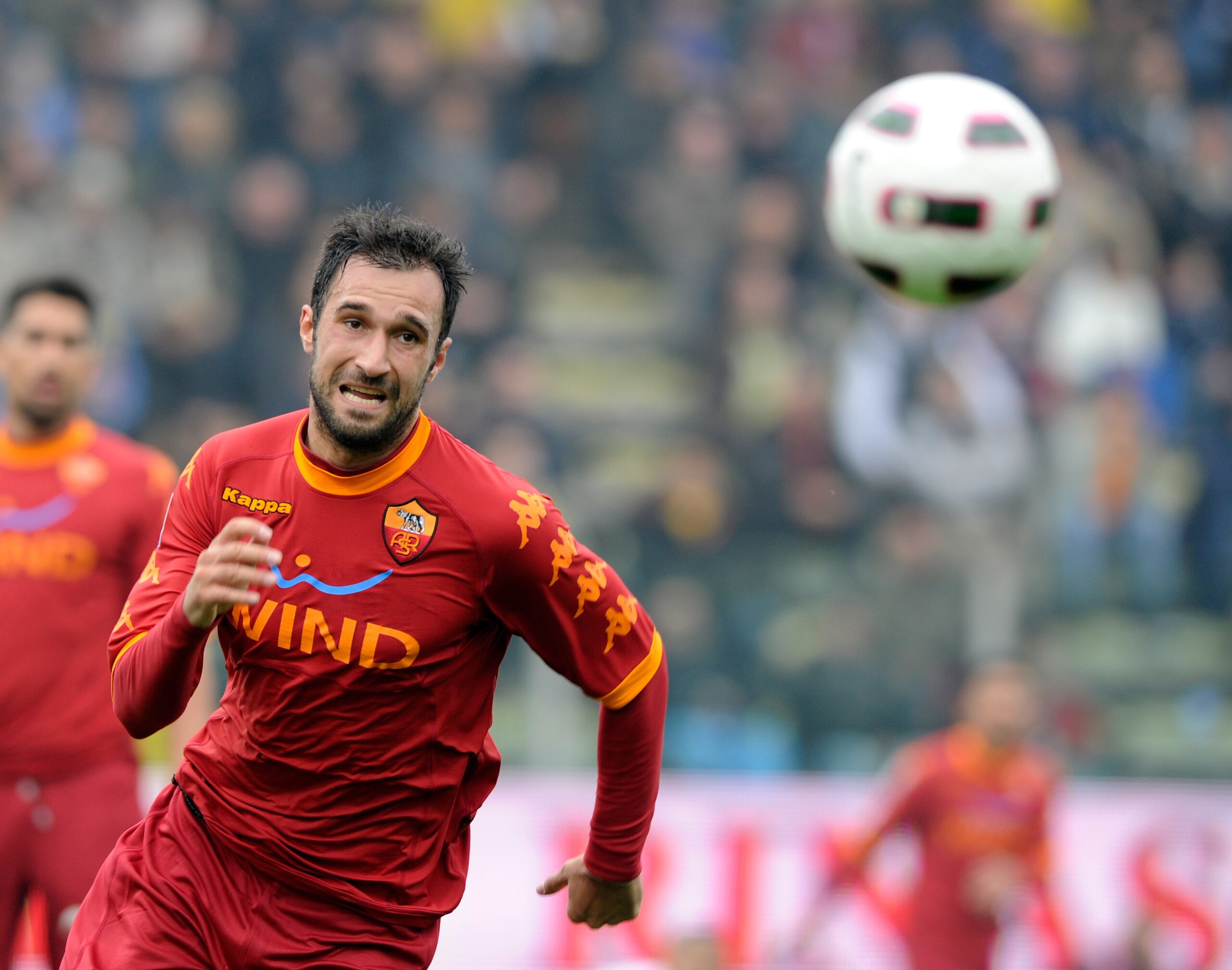 PARMA, ITALY - OCTOBER 24:  Mirko Vucinic of AS Roma pursues the ball during the Serie A match between Parma FC and AS Roma at Stadio Ennio Tardini on October 24, 2010 in Parma, Italy.  (Photo by Claudio Villa/Getty Images)